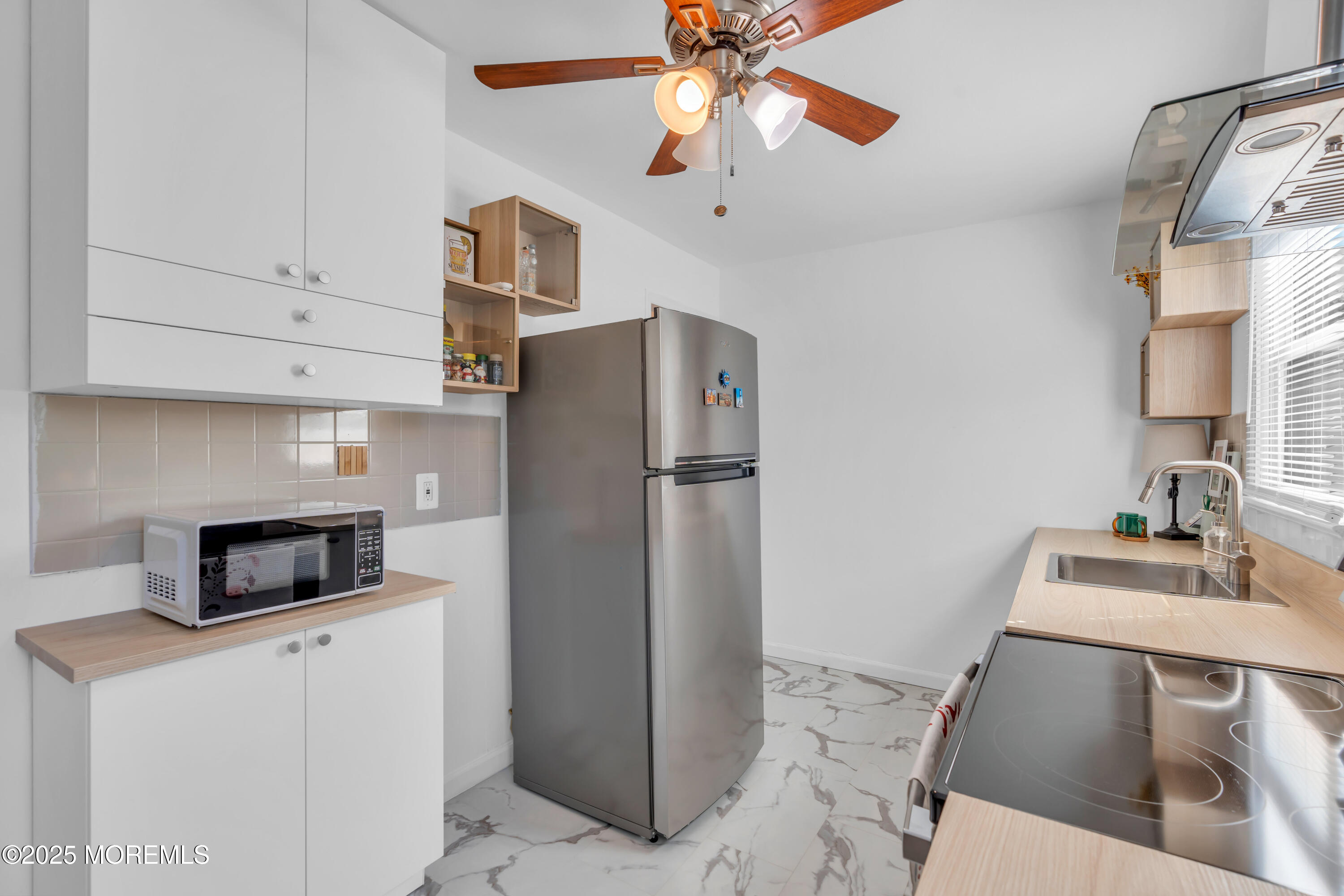 786 Leonardville Road Leonardo, NJ 07737 - Photo 12 of 38 a kitchen with stainless steel appliances a refrigerator sink and microwave