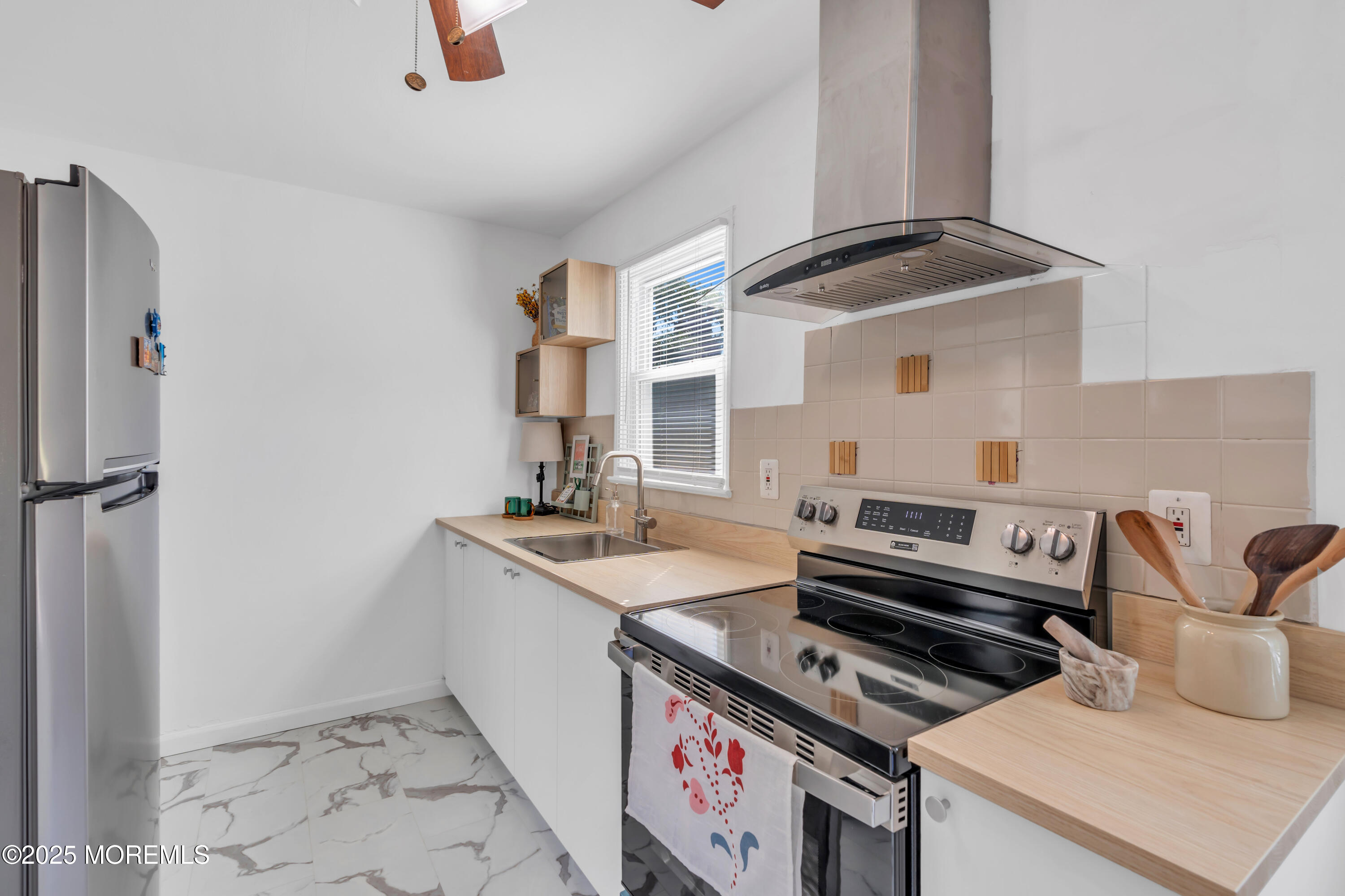 786 Leonardville Road Leonardo, NJ 07737 - Photo 13 of 38 a kitchen with a stove and a sink