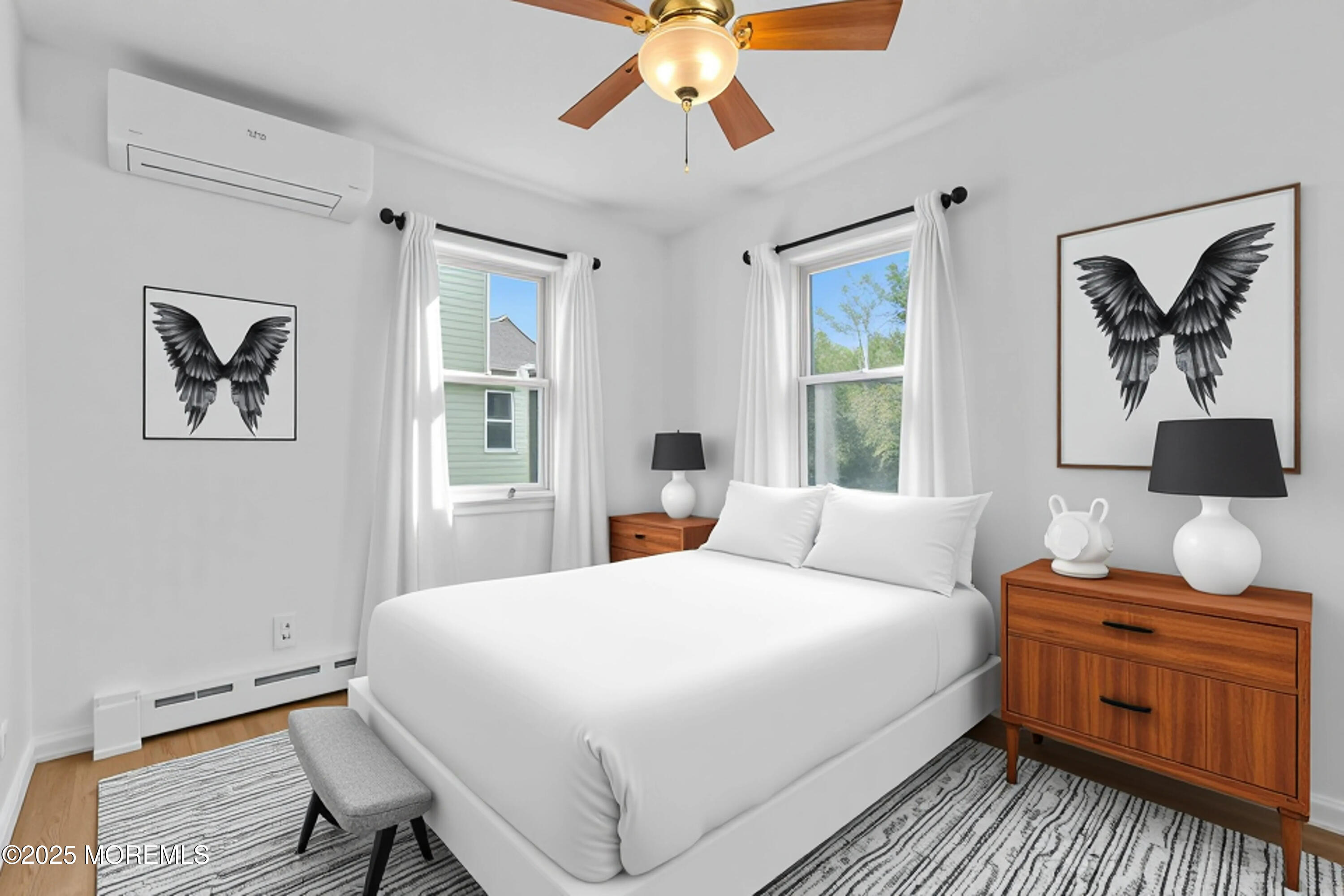 786 Leonardville Road Leonardo, NJ 07737 - Photo 15 of 38 a bedroom with a bed and a chandelier