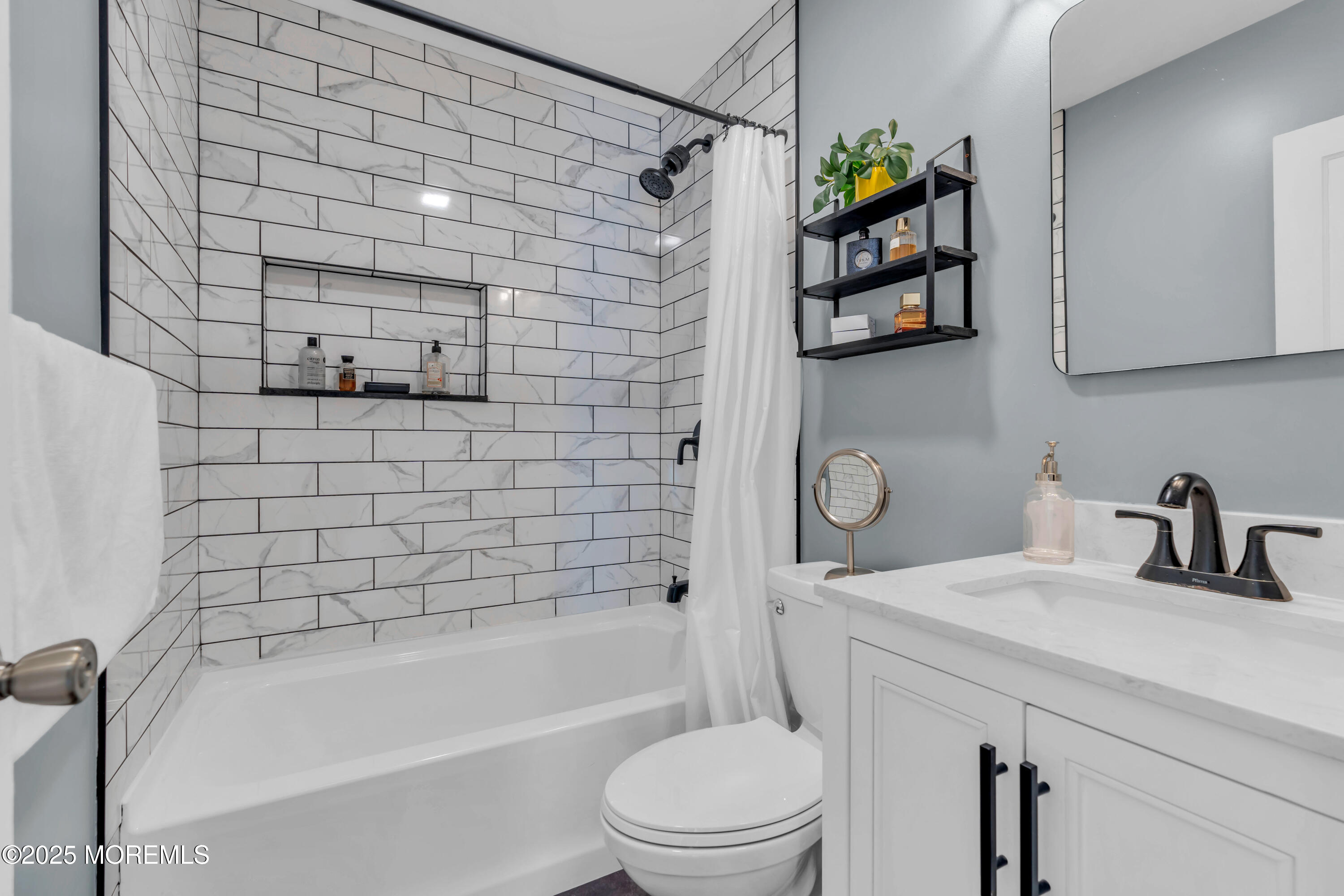 786 Leonardville Road Leonardo, NJ 07737 - Photo 21 of 38 a bathroom with a bathtub shower sink vanity and toilet