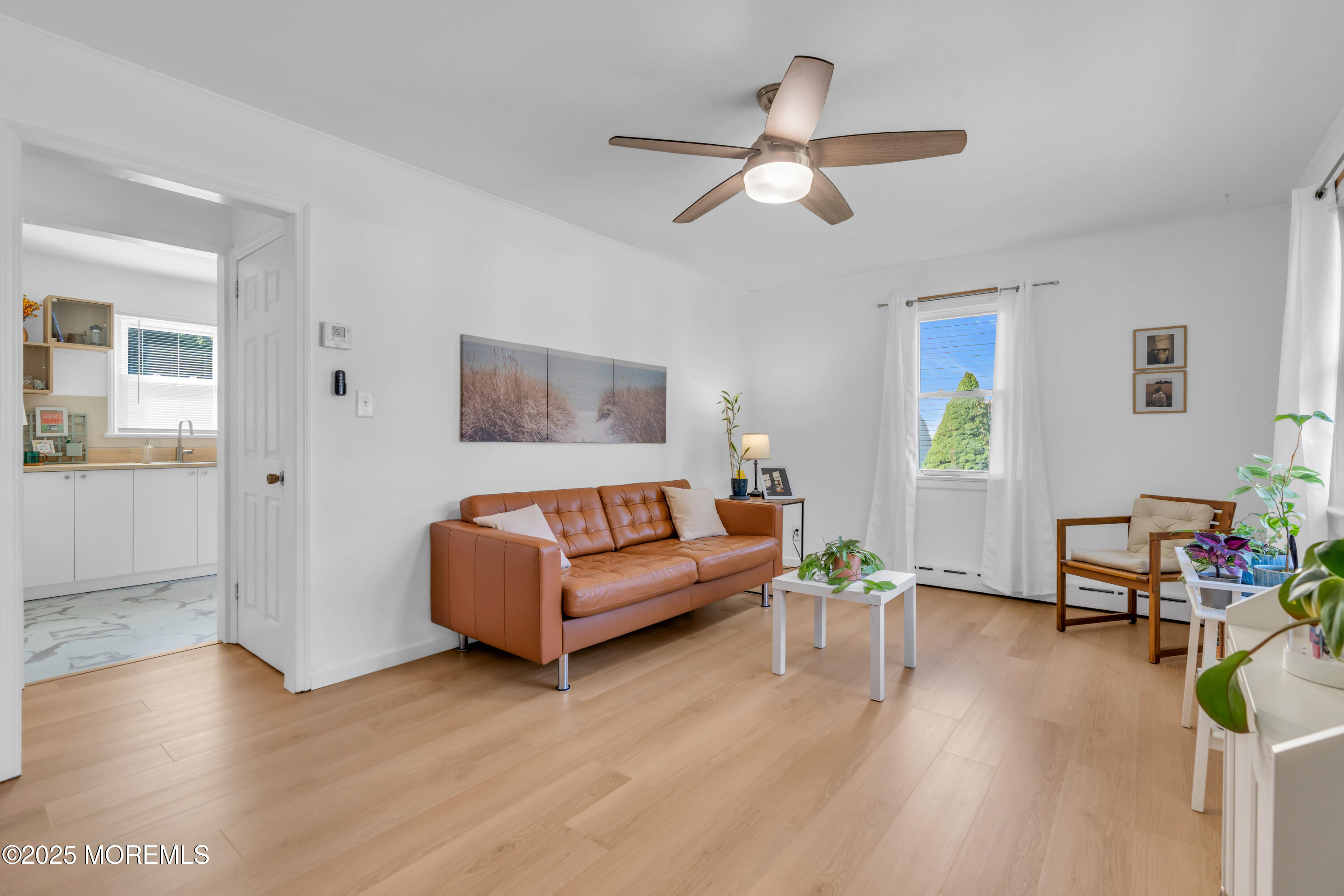 786 Leonardville Road Leonardo, NJ 07737 - Photo 5 of 38 a living room with furniture and a wooden floor