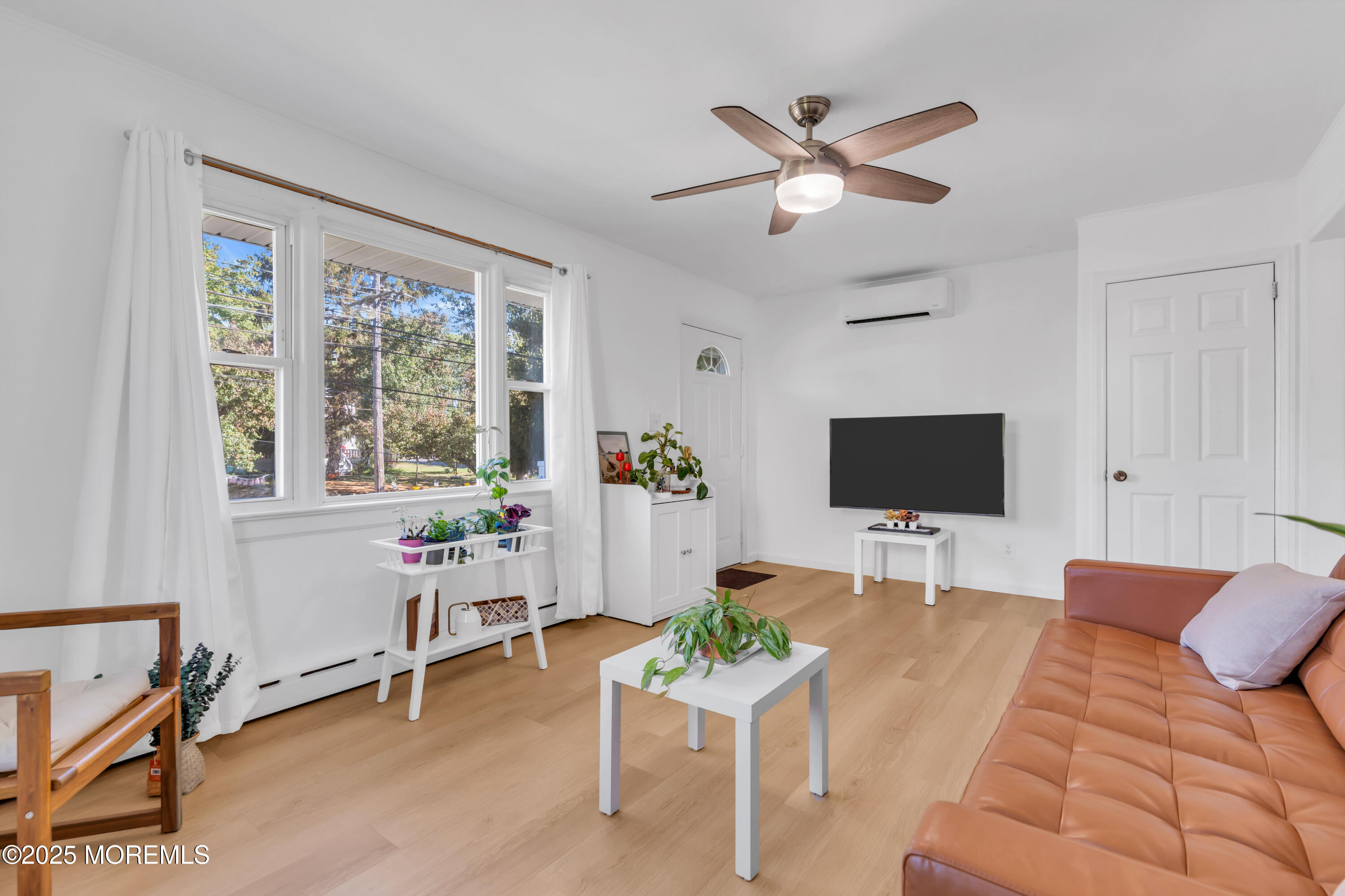 786 Leonardville Road Leonardo, NJ 07737 - Photo 7 of 38 a living room with furniture and a flat screen tv