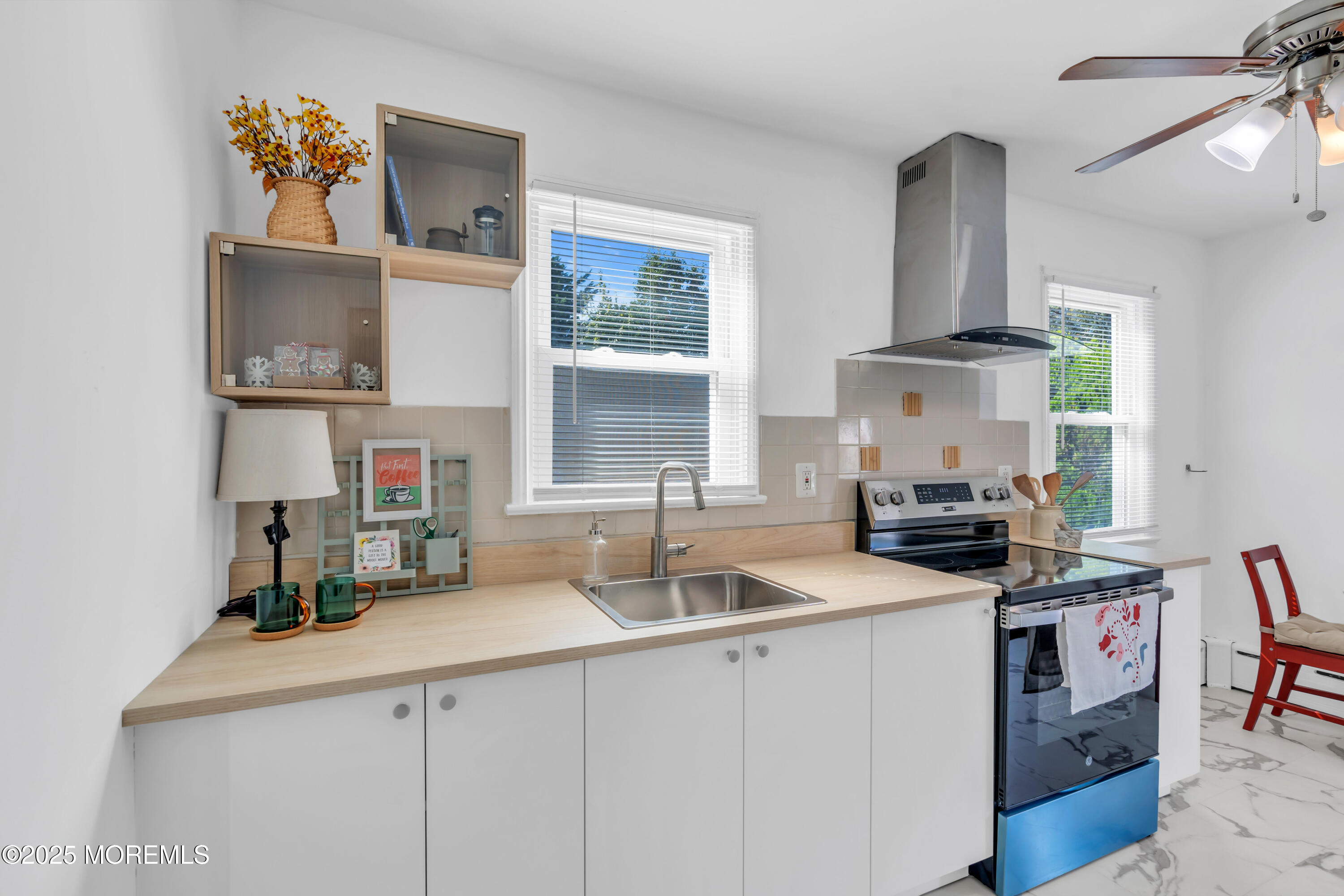 786 Leonardville Road Leonardo, NJ 07737 - Photo 9 of 38 a kitchen with a sink stove and cabinets
