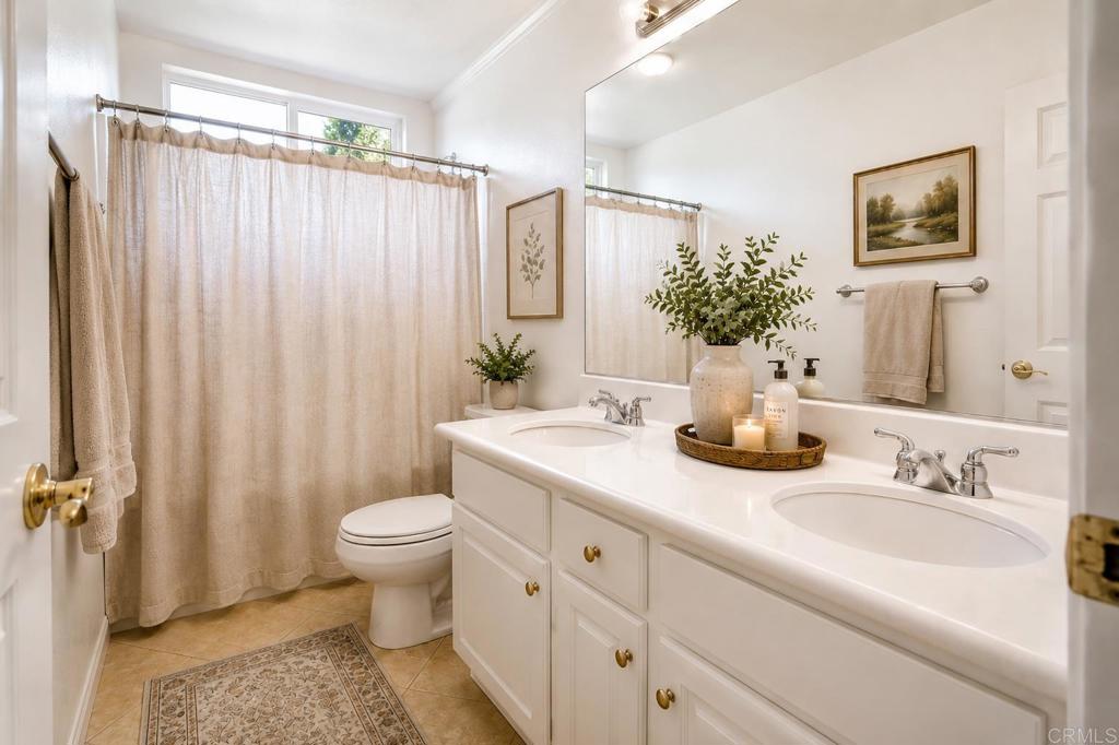 672 Inverlochy Drive Fallbrook, CA 92028 - Photo 51 of 75 a bathroom with a granite countertop sink toilet and shower