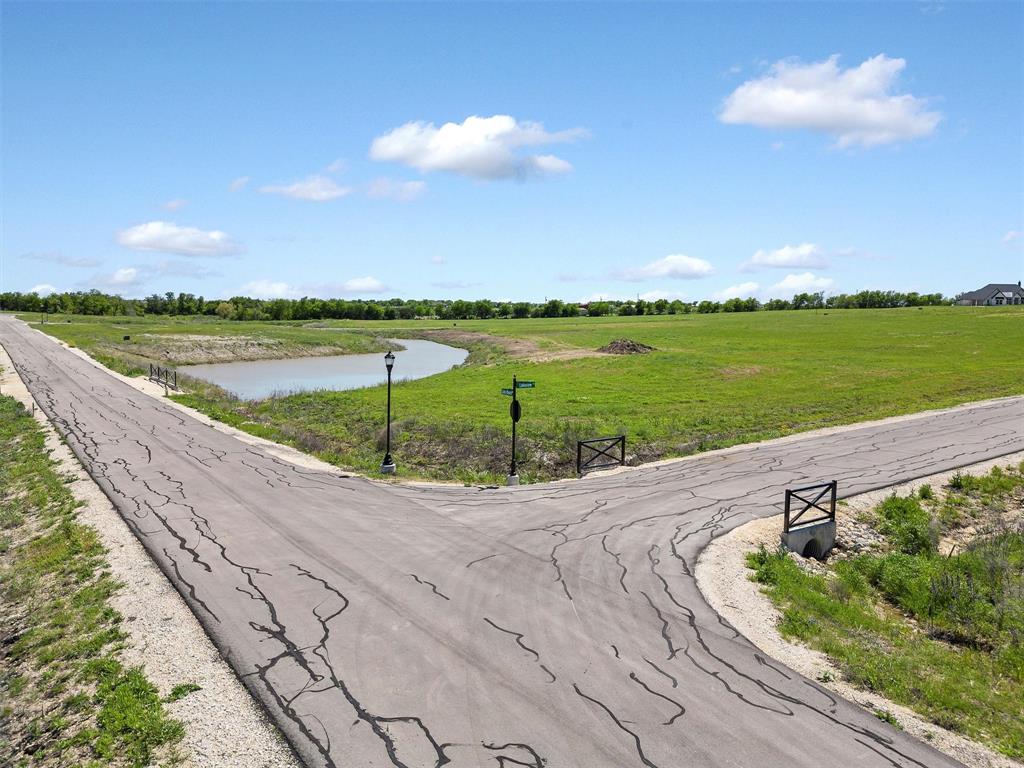 6432 Wind Hills Road Godley, TX 76044 - Photo 13 of 31 View of road with a rural view and a water view