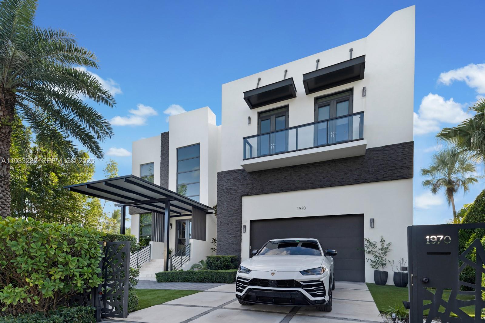 1970 Northeast 119th Road North Miami, FL 33181 - Photo 12 of 54 a car parked in front of a house