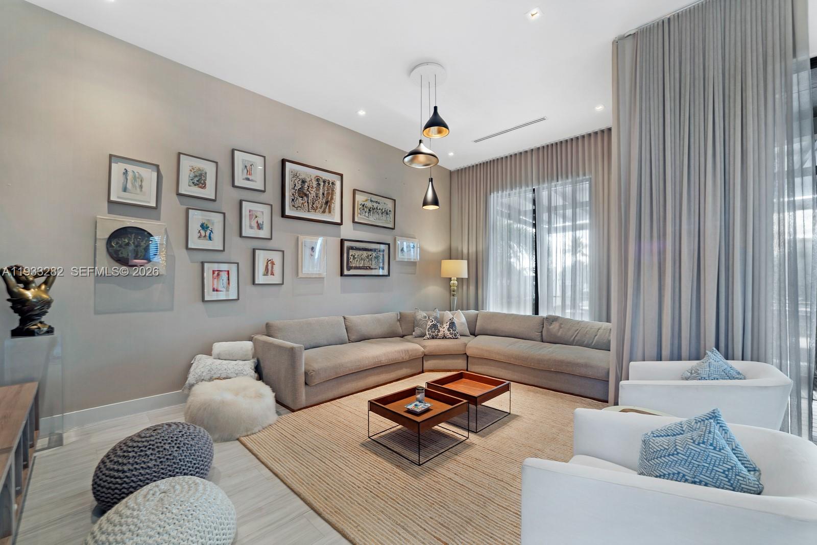 1970 Northeast 119th Road North Miami, FL 33181 - Photo 19 of 54 a living room with furniture rug and window