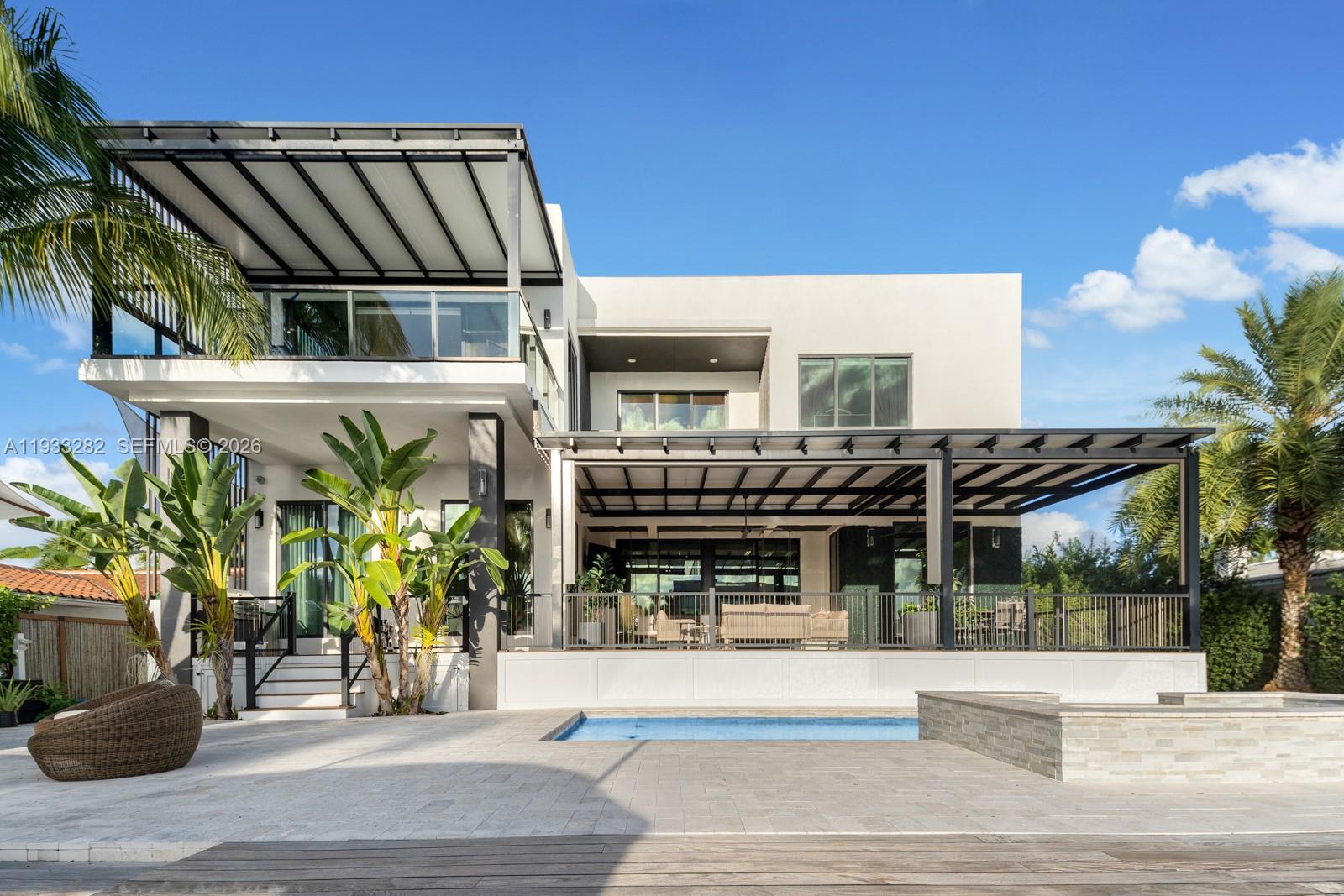 1970 Northeast 119th Road North Miami, FL 33181 - Photo 2 of 54 a view of tall building with a potted plant