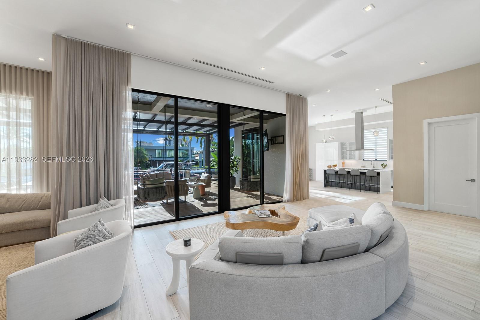 1970 Northeast 119th Road North Miami, FL 33181 - Photo 23 of 54 a living room with furniture and a large window