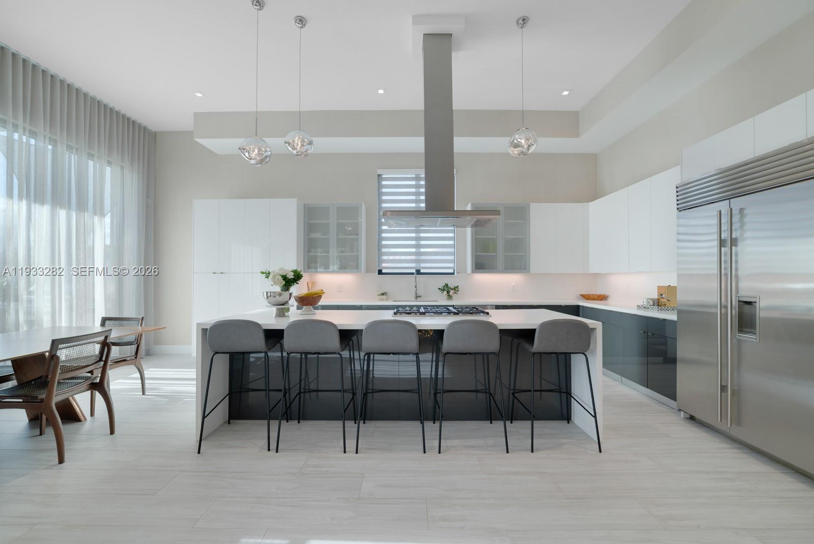 1970 Northeast 119th Road North Miami, FL 33181 - Photo 25 of 54 a kitchen with a table and chairs in it
