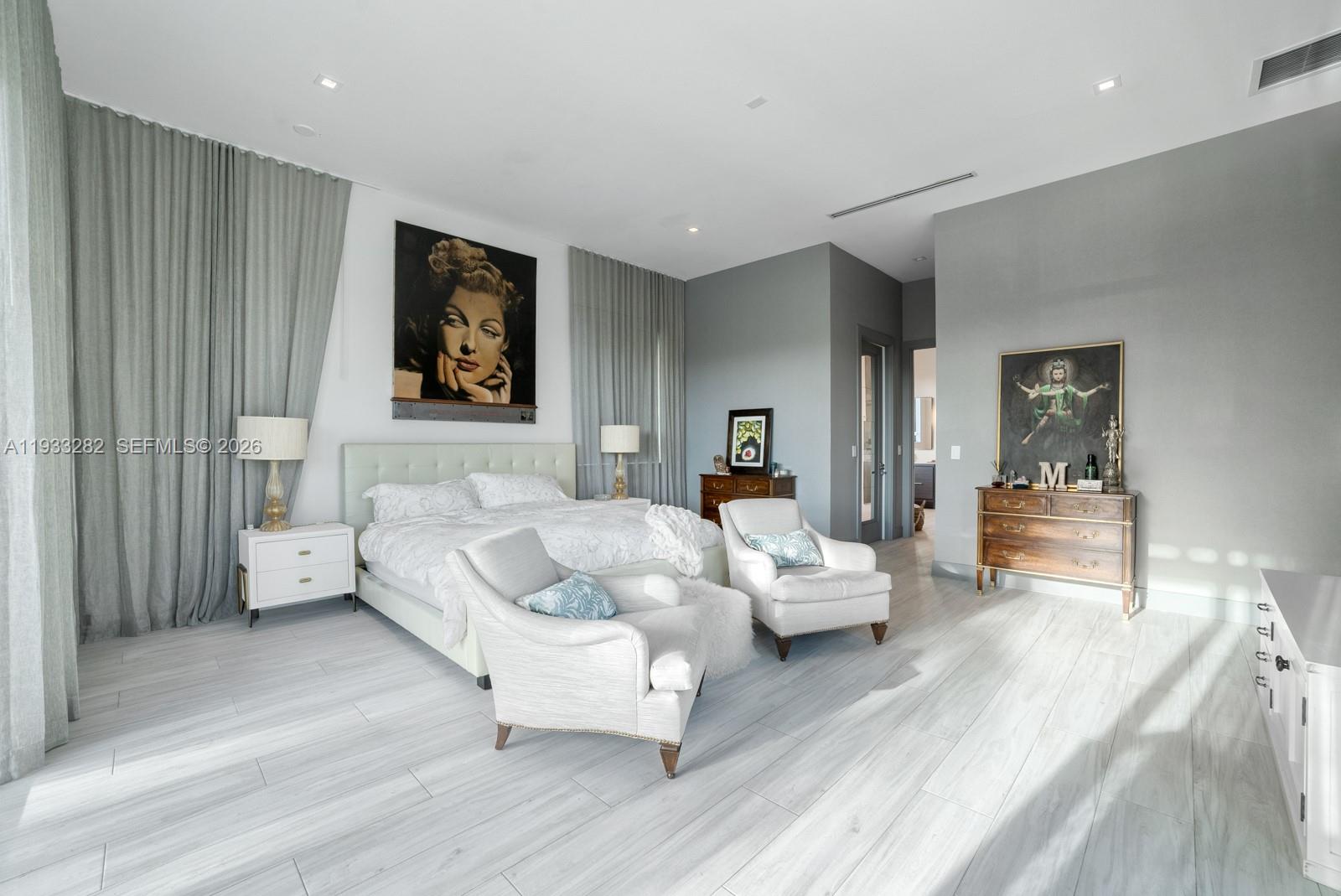 1970 Northeast 119th Road North Miami, FL 33181 - Photo 30 of 54 a living room with furniture and a wooden floor