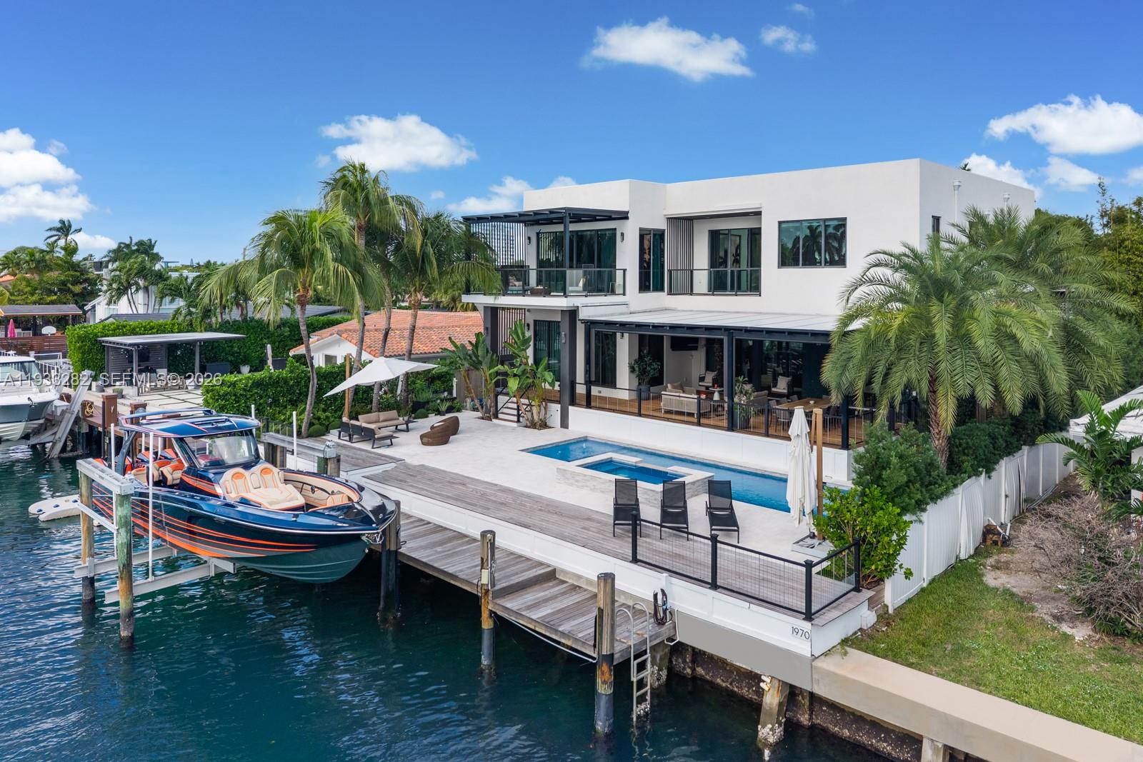 1970 Northeast 119th Road North Miami, FL 33181 - Photo 3 of 54 a view of swimming pool with outdoor seating and plants
