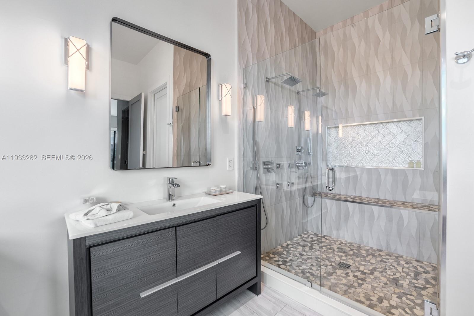 1970 Northeast 119th Road North Miami, FL 33181 - Photo 40 of 54 a bathroom with a sink and a mirror
