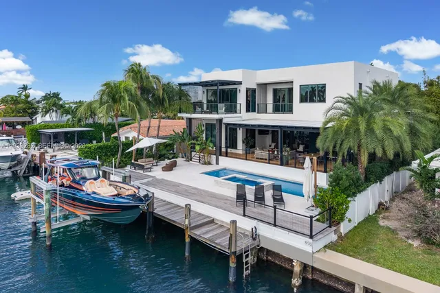 a view of swimming pool with outdoor seating and plants