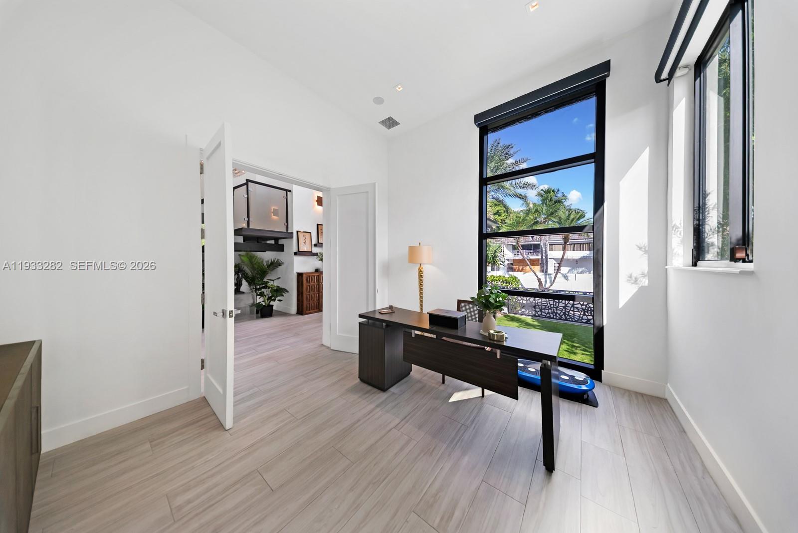 1970 Northeast 119th Road North Miami, FL 33181 - Photo 42 of 54 a living room with furniture and a wooden floor