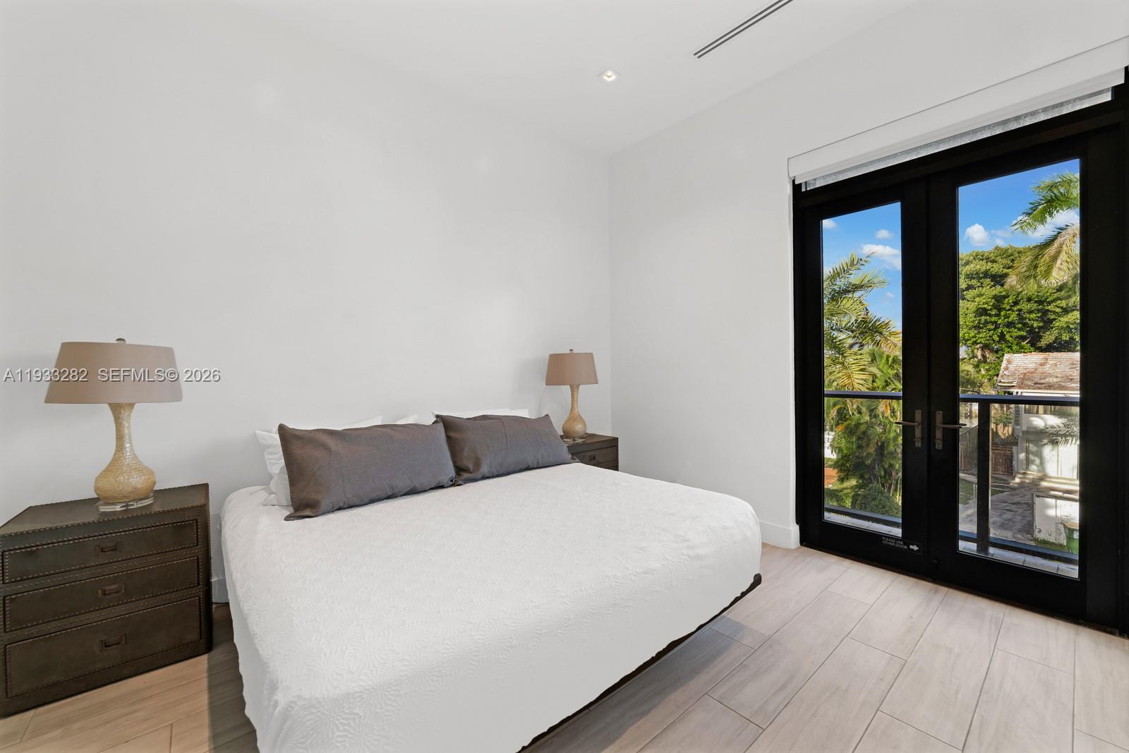 1970 Northeast 119th Road North Miami, FL 33181 - Photo 43 of 54 a bedroom with a bed and a window