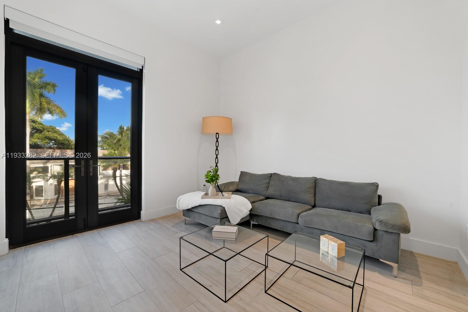 1970 Northeast 119th Road North Miami, FL 33181 - Photo 44 of 54 a living room with furniture and a window