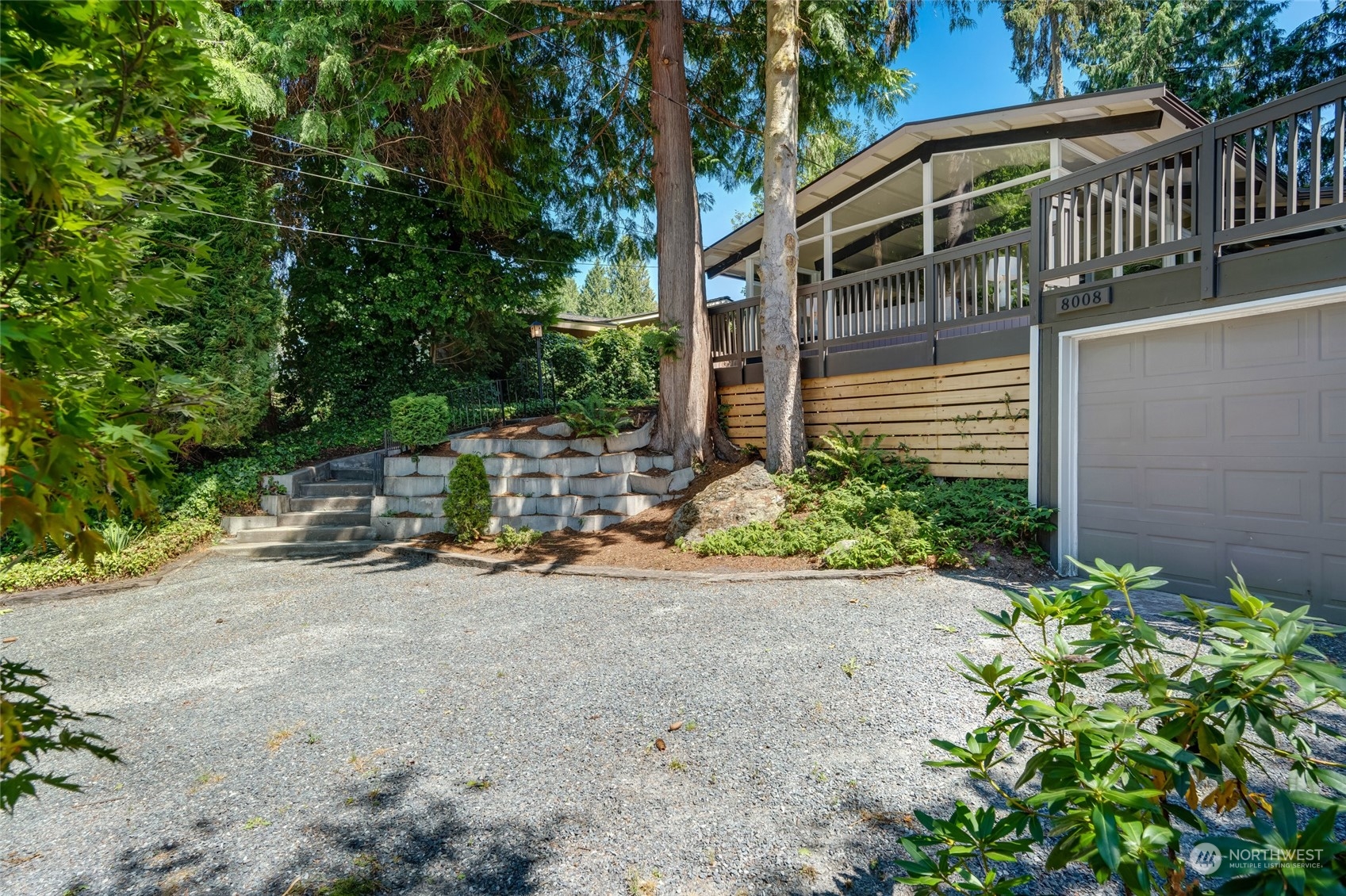 8008 Talbot Road Edmonds, WA 98026 - Photo 3 of 30 a view of a chair and table in the garden