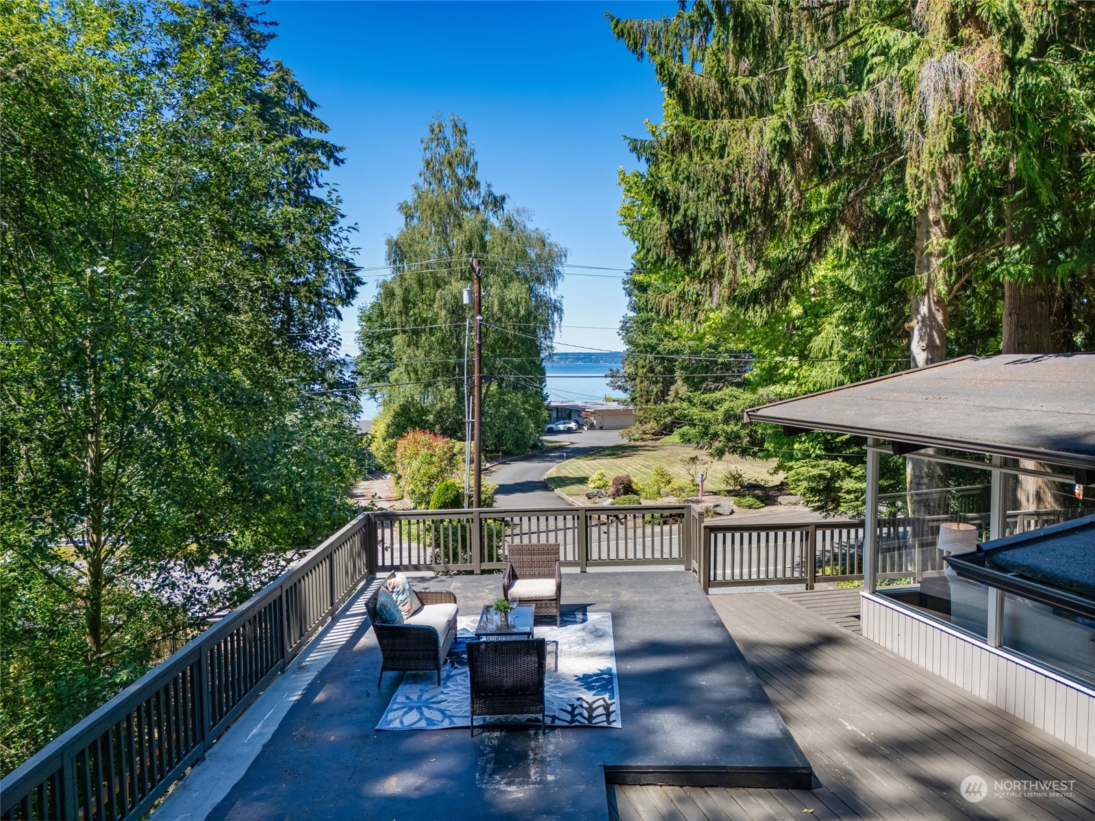 8008 Talbot Road Edmonds, WA 98026 - Photo 8 of 30 a view of house with patio outdoor seating and trees