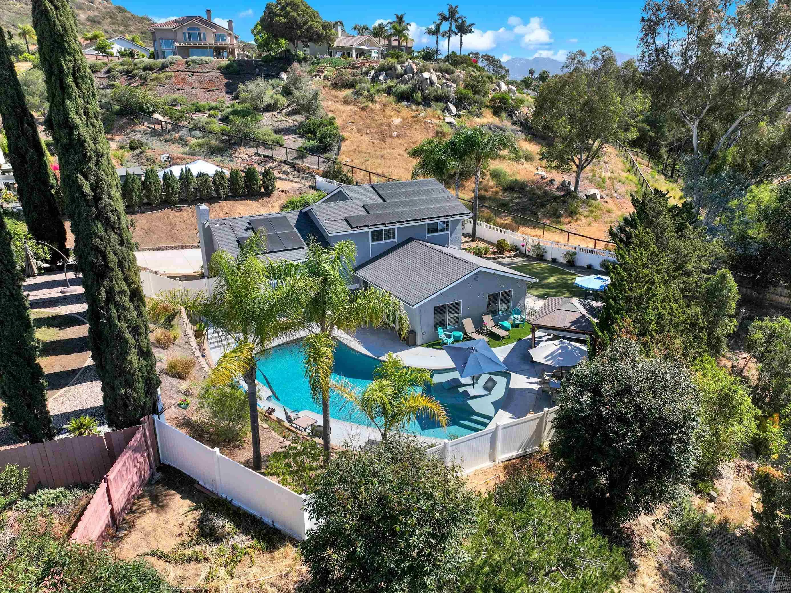 12913 Evalyn Court Poway, CA 92064 - Photo 1 of 56 an aerial view of house with yard and mountain view in back