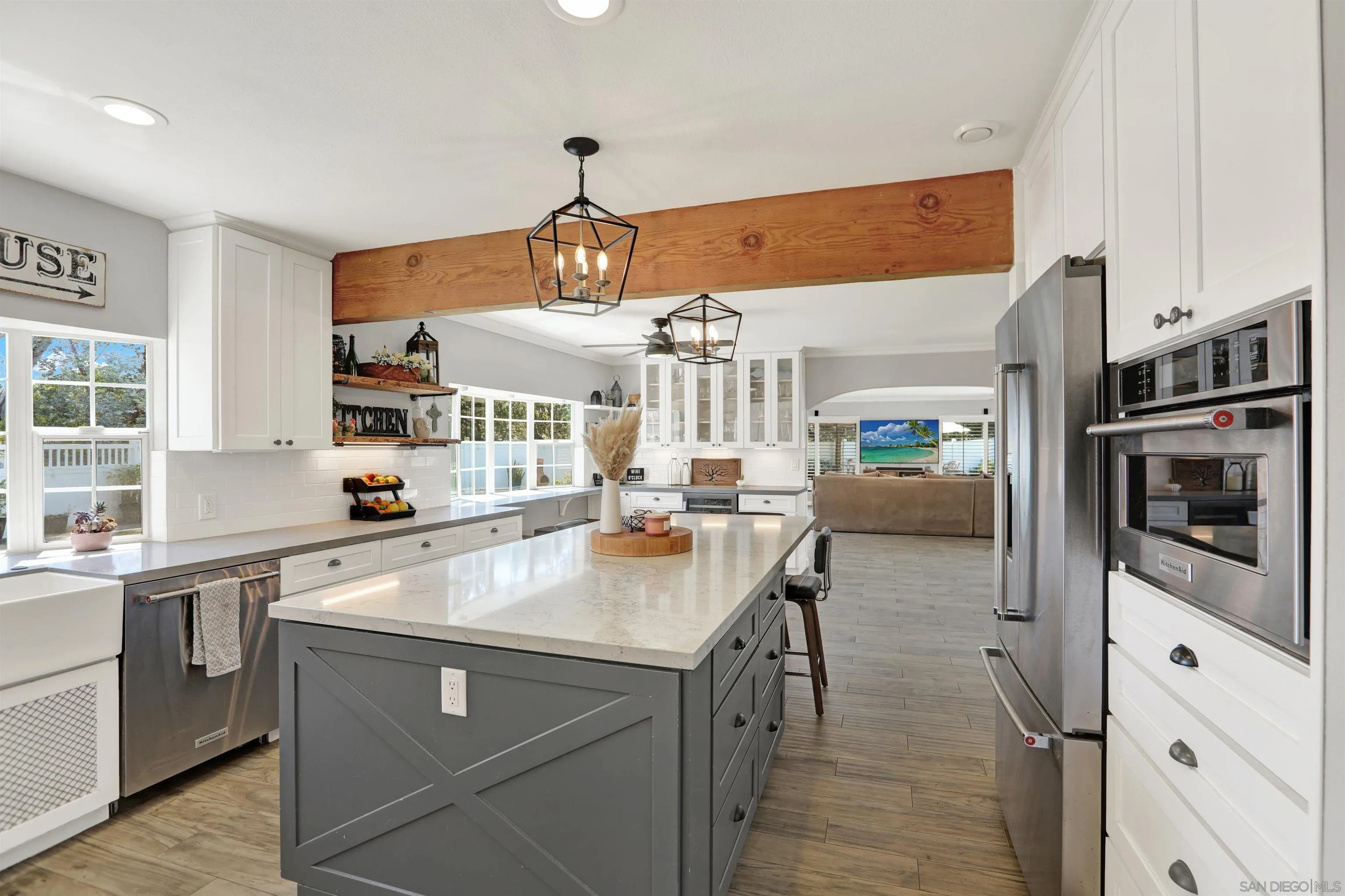 12913 Evalyn Court Poway, CA 92064 - Photo 14 of 56 a kitchen with stainless steel appliances a sink stove and refrigerator