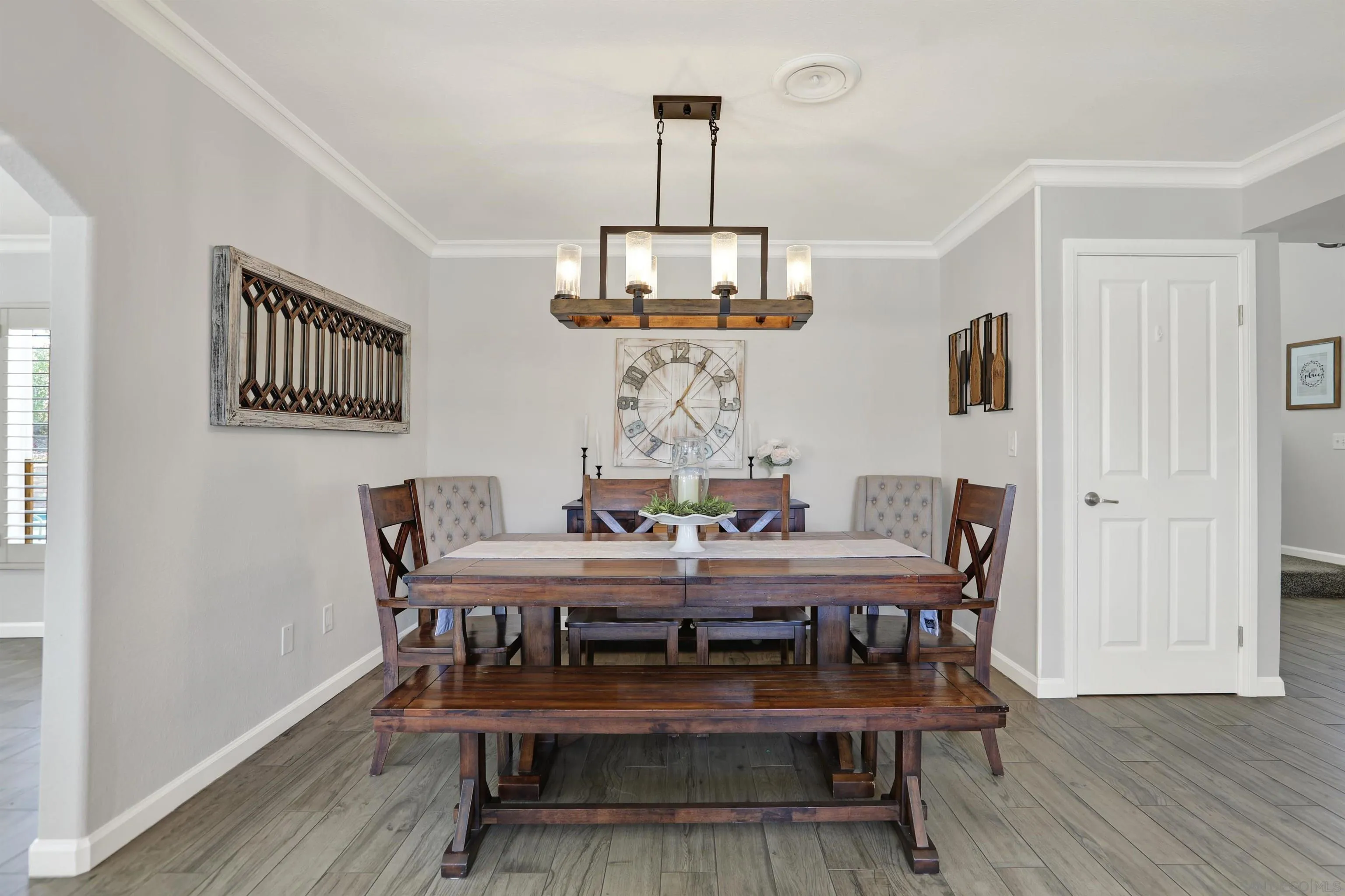 12913 Evalyn Court Poway, CA 92064 - Photo 16 of 56 a view of a dining room with furniture wooden floor and chandelier