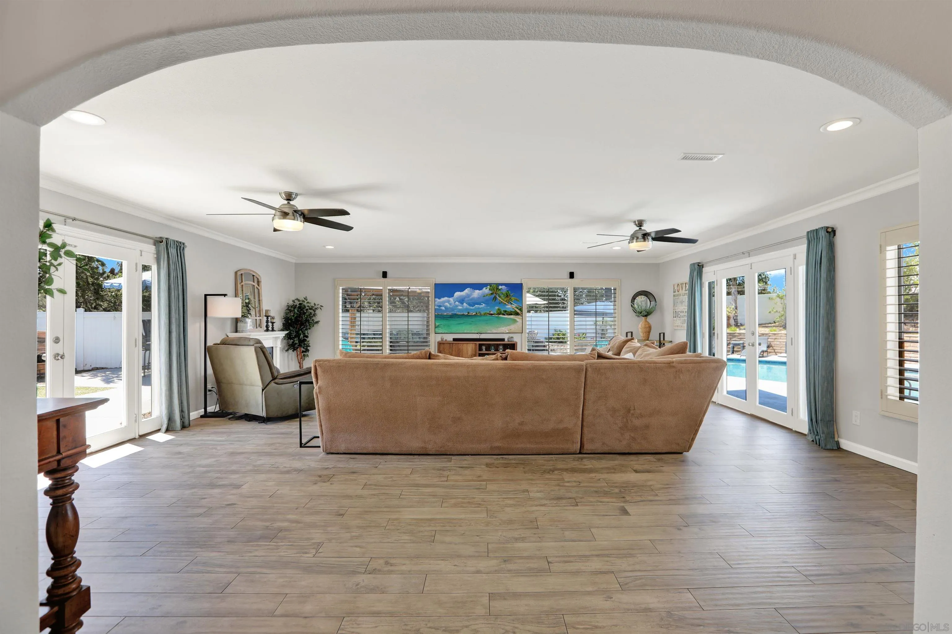 12913 Evalyn Court Poway, CA 92064 - Photo 17 of 56 a living room with furniture and a large window