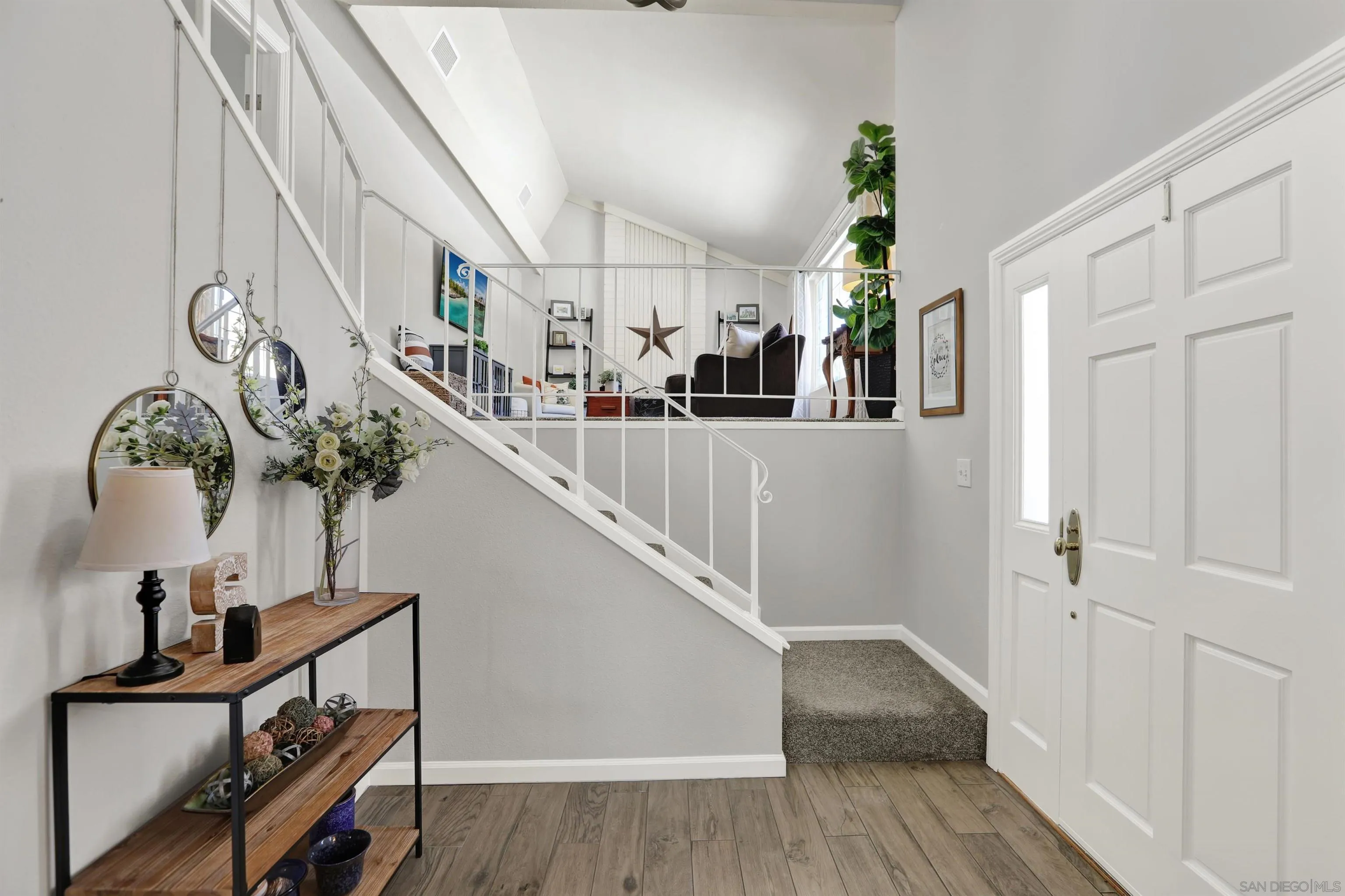12913 Evalyn Court Poway, CA 92064 - Photo 22 of 56 a view of entryway and hall with wooden floor