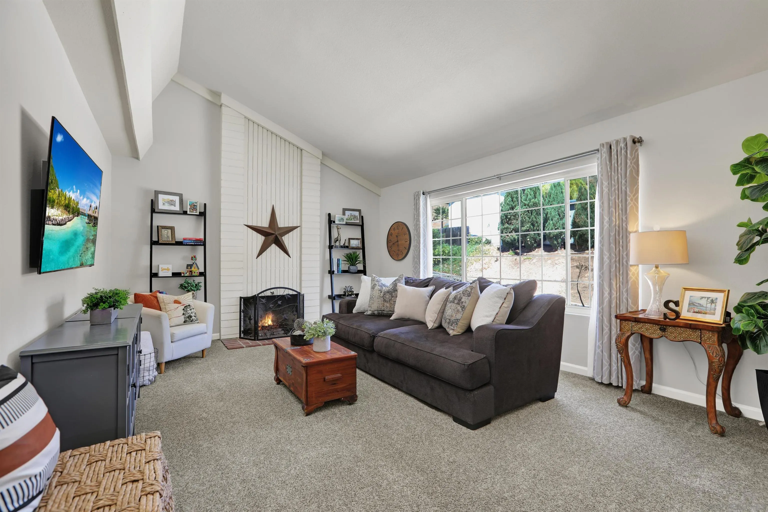 12913 Evalyn Court Poway, CA 92064 - Photo 23 of 56 a living room with furniture and a fireplace