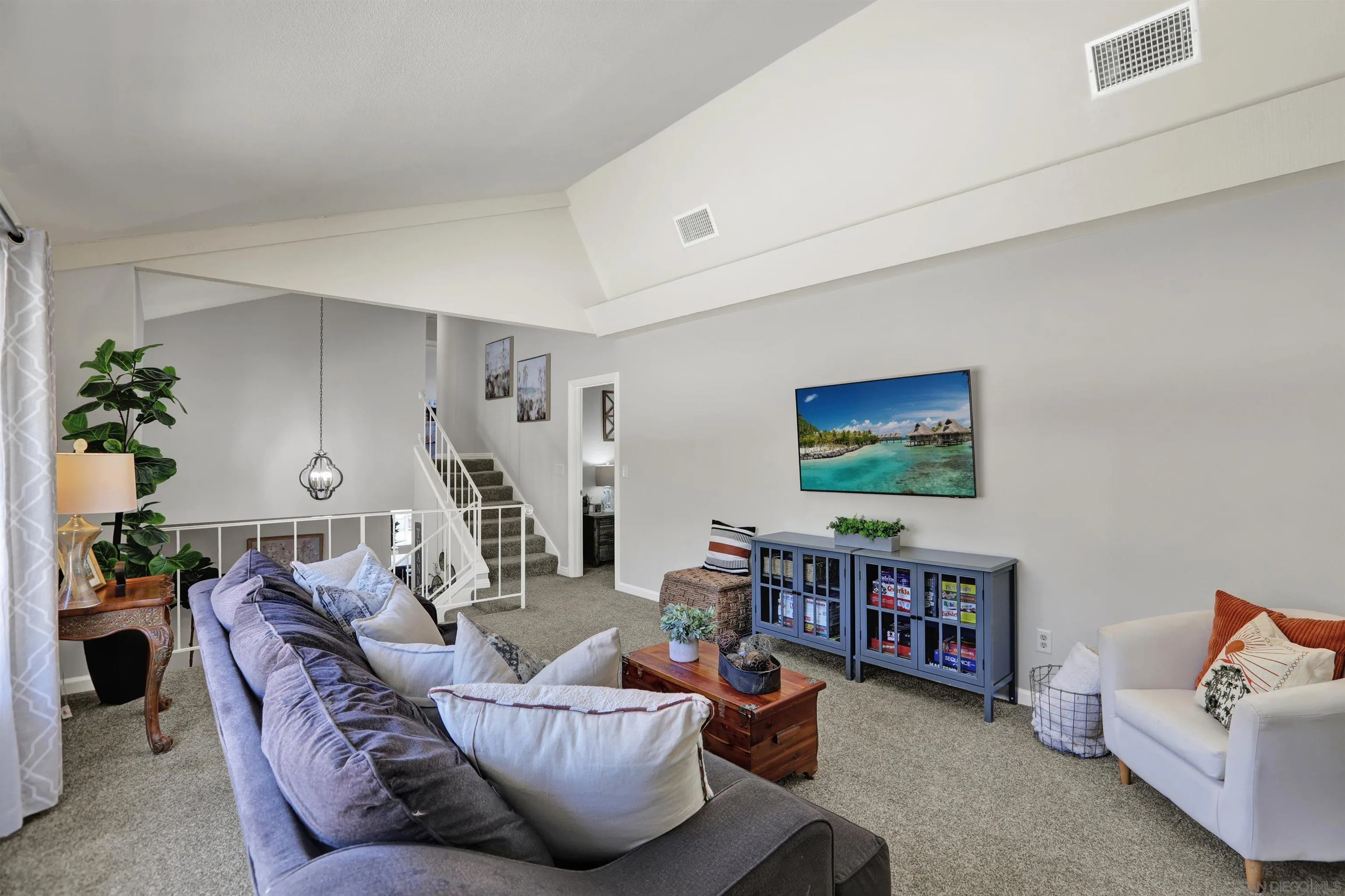 12913 Evalyn Court Poway, CA 92064 - Photo 24 of 56 a living room with furniture and a flat screen tv