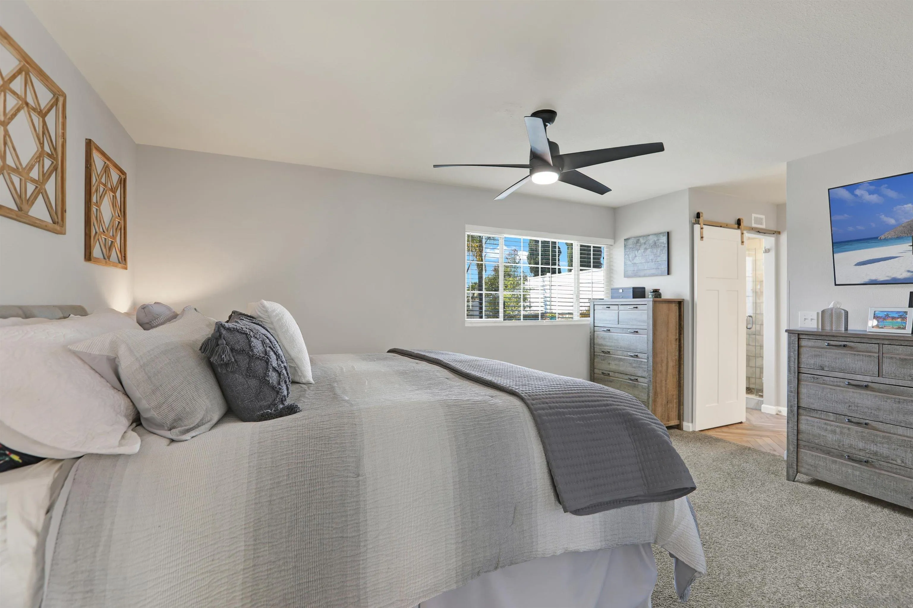 12913 Evalyn Court Poway, CA 92064 - Photo 25 of 56 a bedroom with a bed and a chandelier