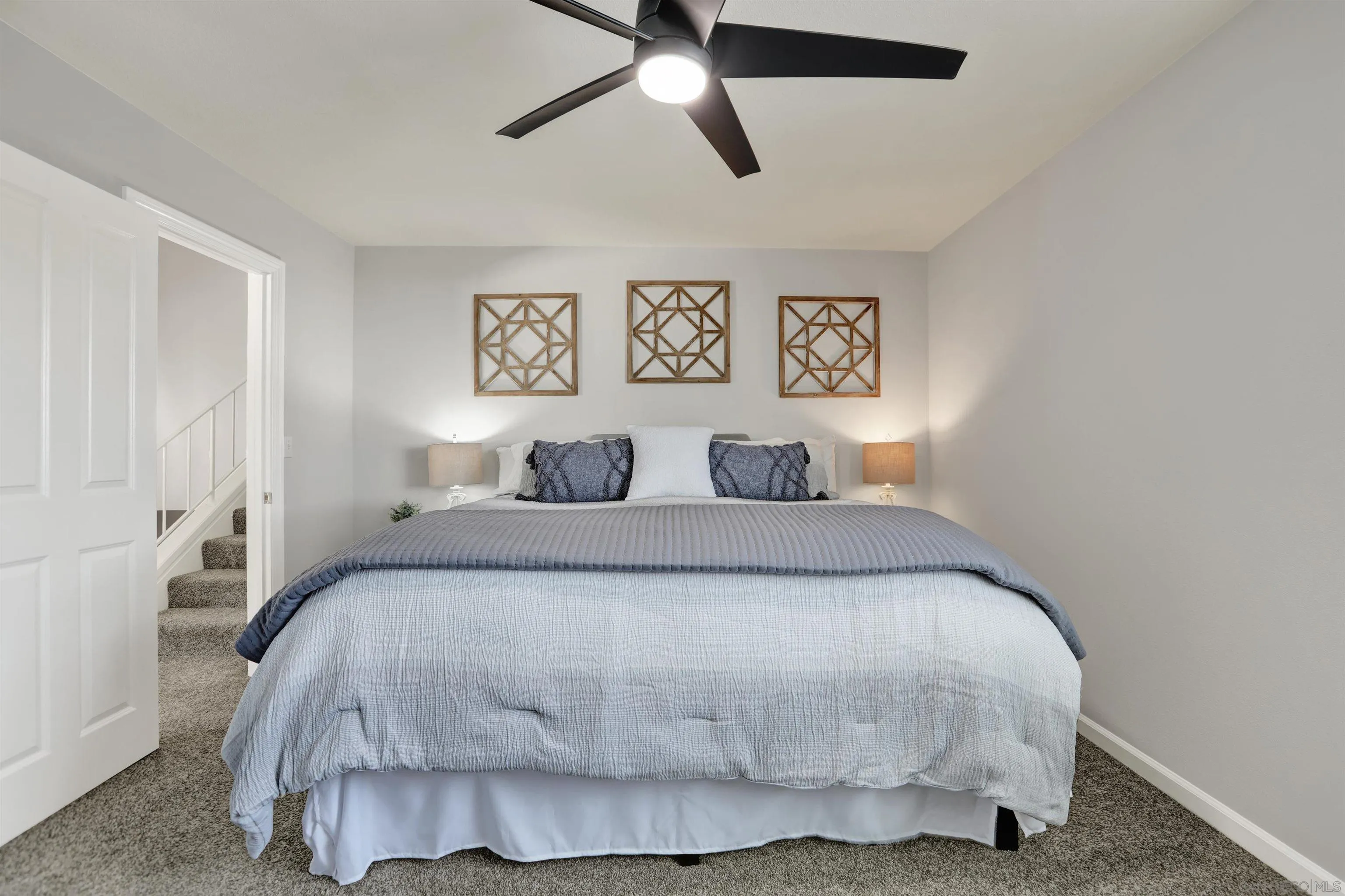 12913 Evalyn Court Poway, CA 92064 - Photo 26 of 56 a bedroom with a bed and painting on the wall