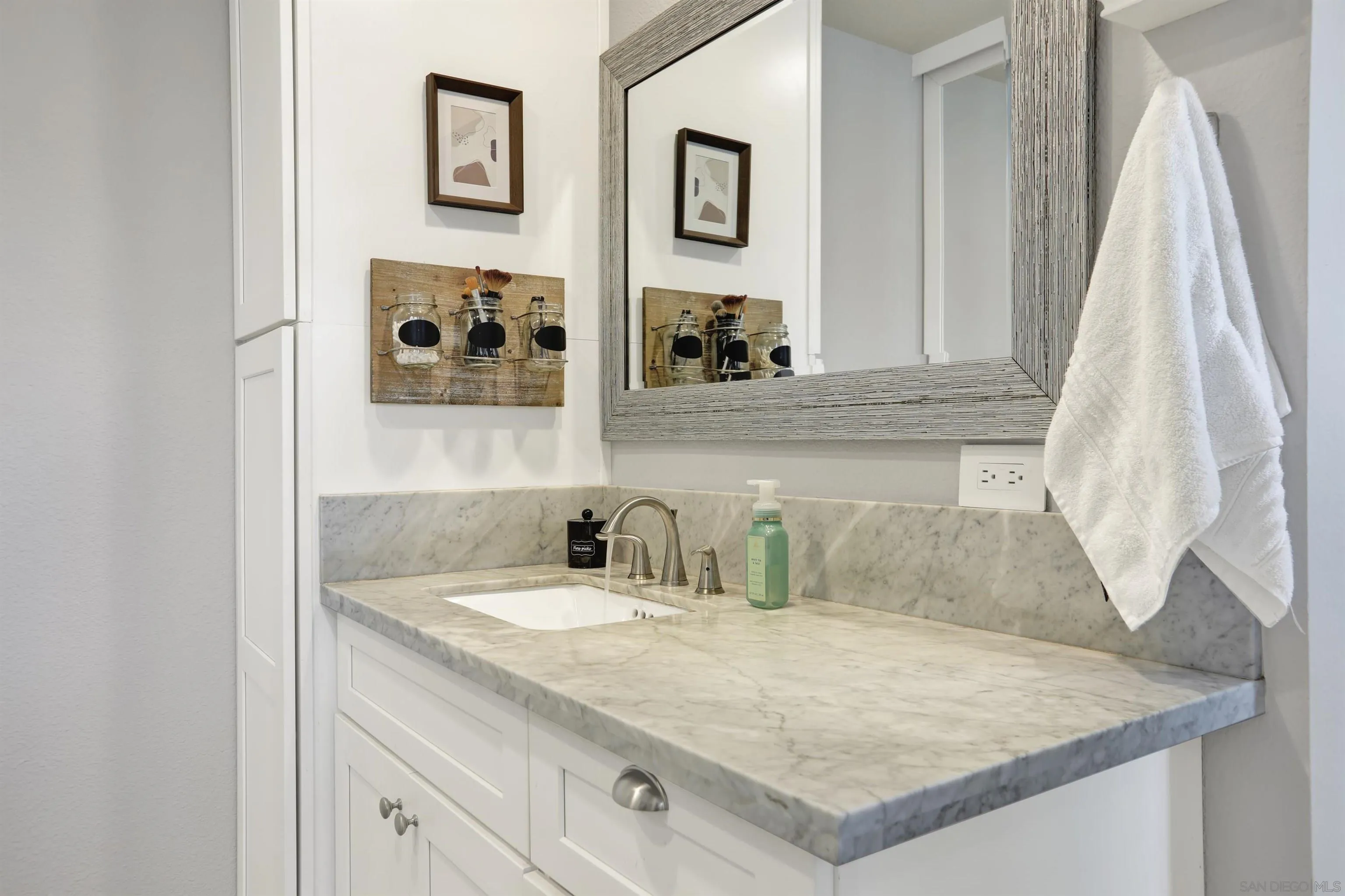 12913 Evalyn Court Poway, CA 92064 - Photo 27 of 56 a bathroom with a sink and a mirror