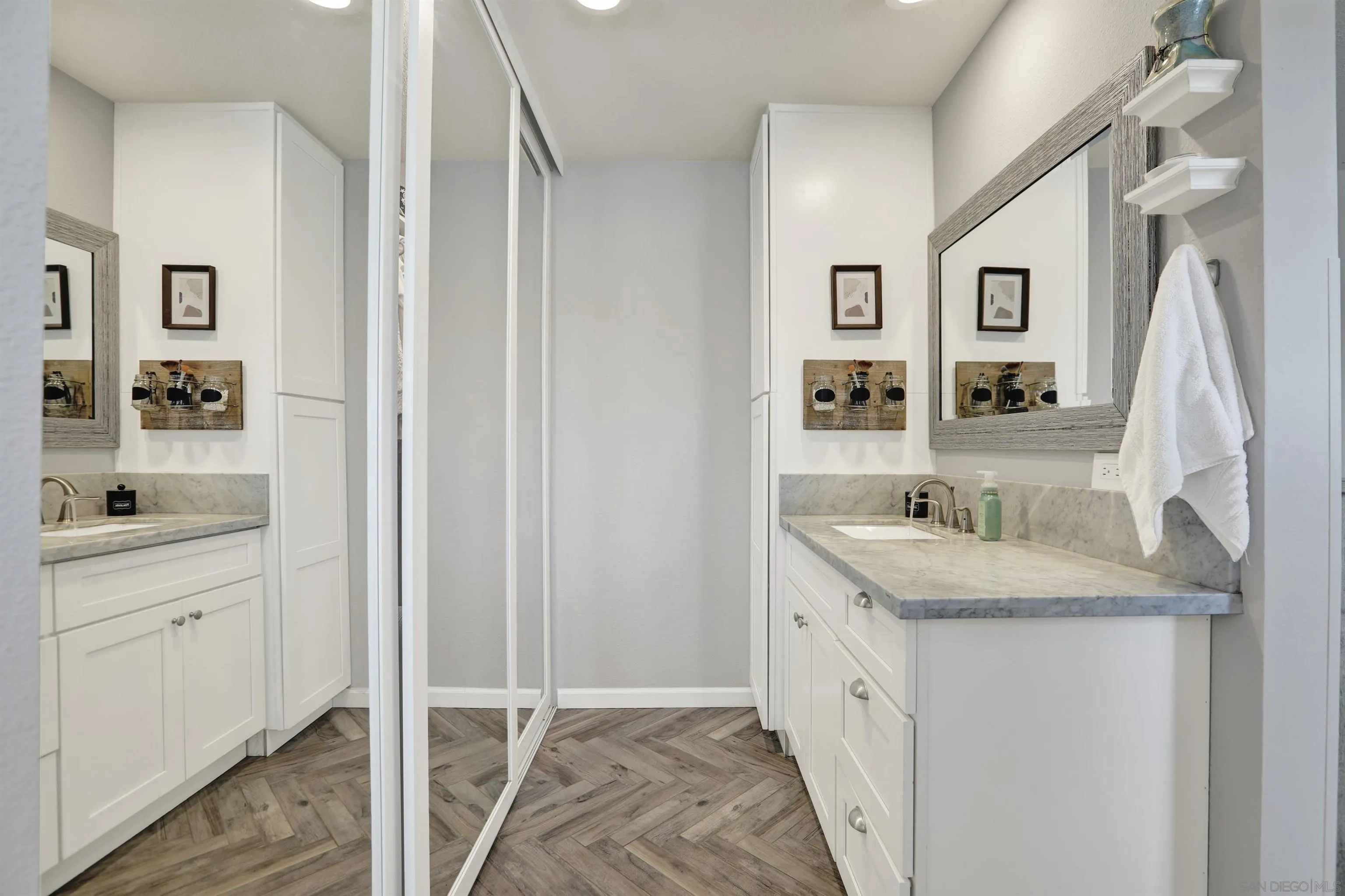 12913 Evalyn Court Poway, CA 92064 - Photo 28 of 56 a bathroom with a granite countertop double vanity sink and a mirror