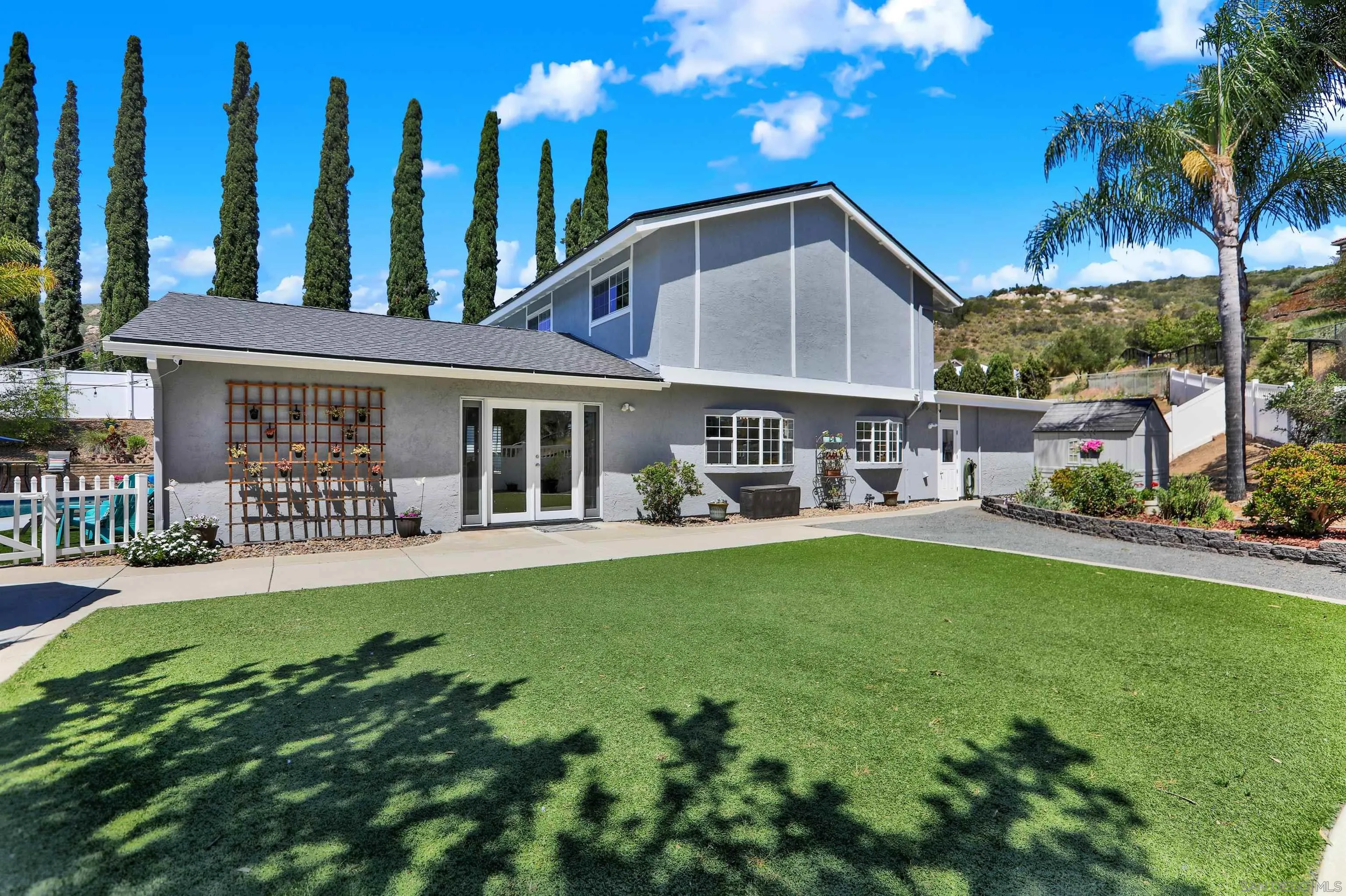 12913 Evalyn Court Poway, CA 92064 - Photo 3 of 56 a front view of house with yard and outdoor seating