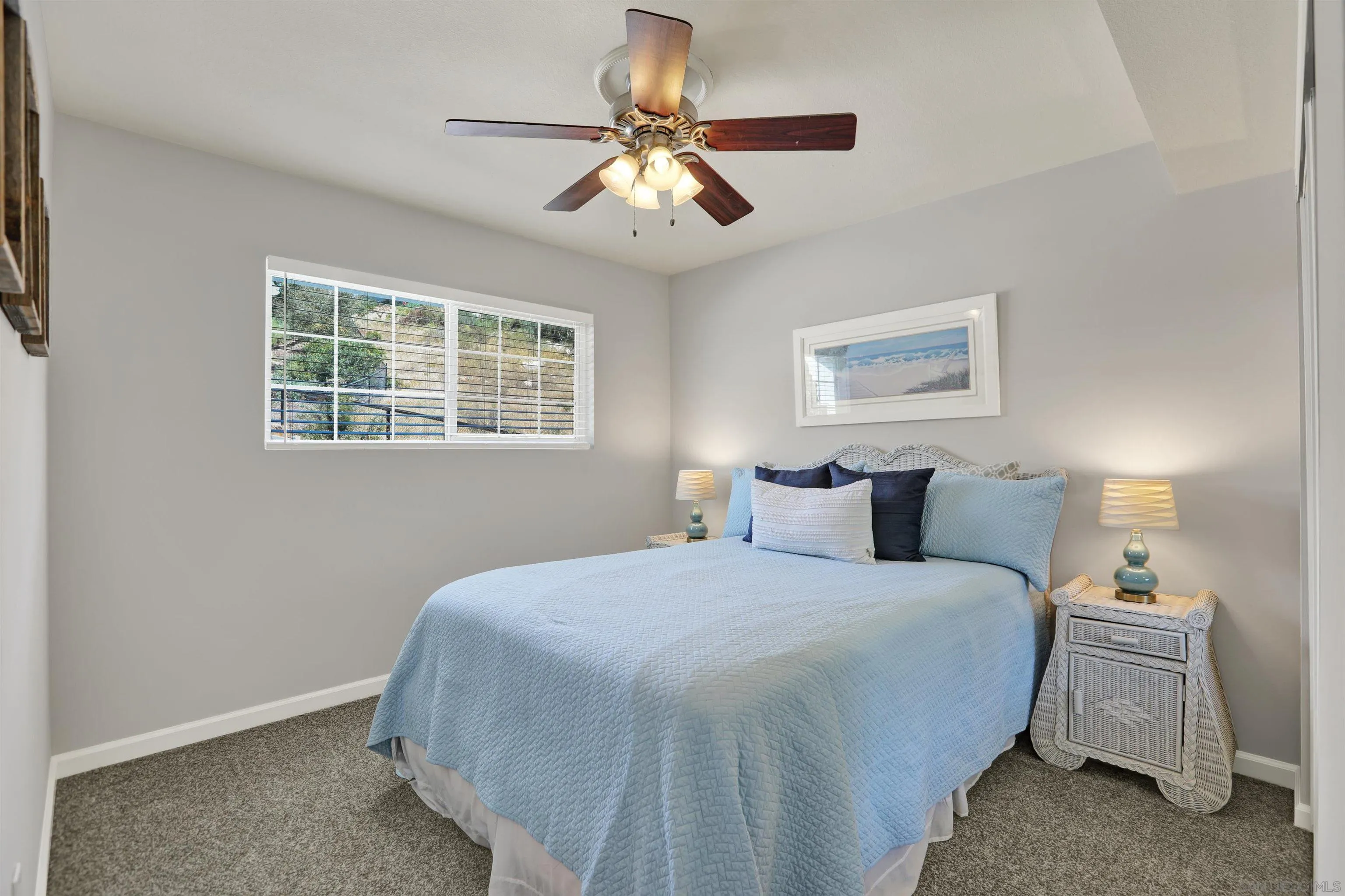 12913 Evalyn Court Poway, CA 92064 - Photo 31 of 56 a bedroom with bed and a chandelier