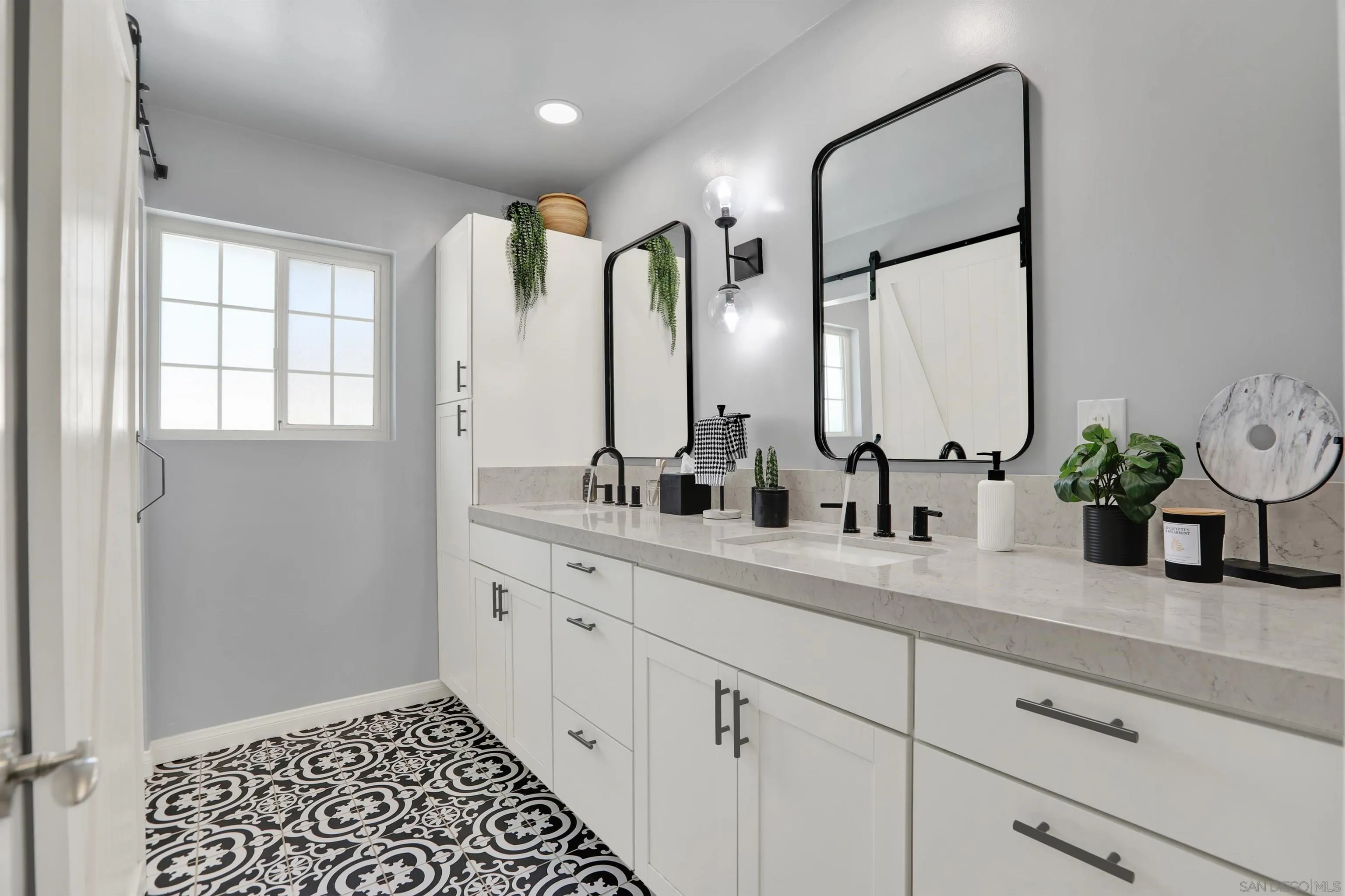 12913 Evalyn Court Poway, CA 92064 - Photo 33 of 56 a bathroom with a granite countertop sink a potted plant and mirror