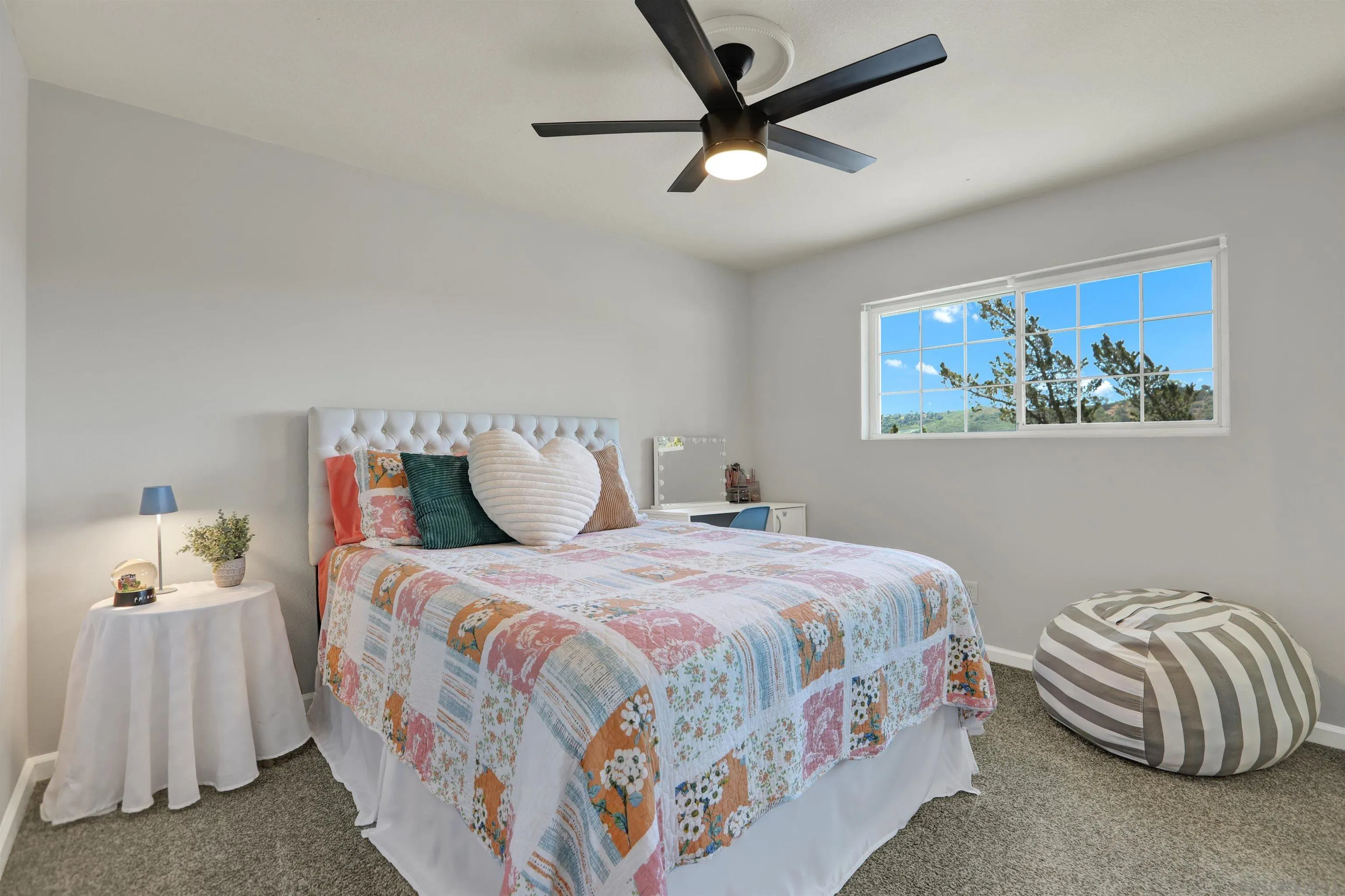 12913 Evalyn Court Poway, CA 92064 - Photo 37 of 56 a bedroom with a bed and a painting on the wall