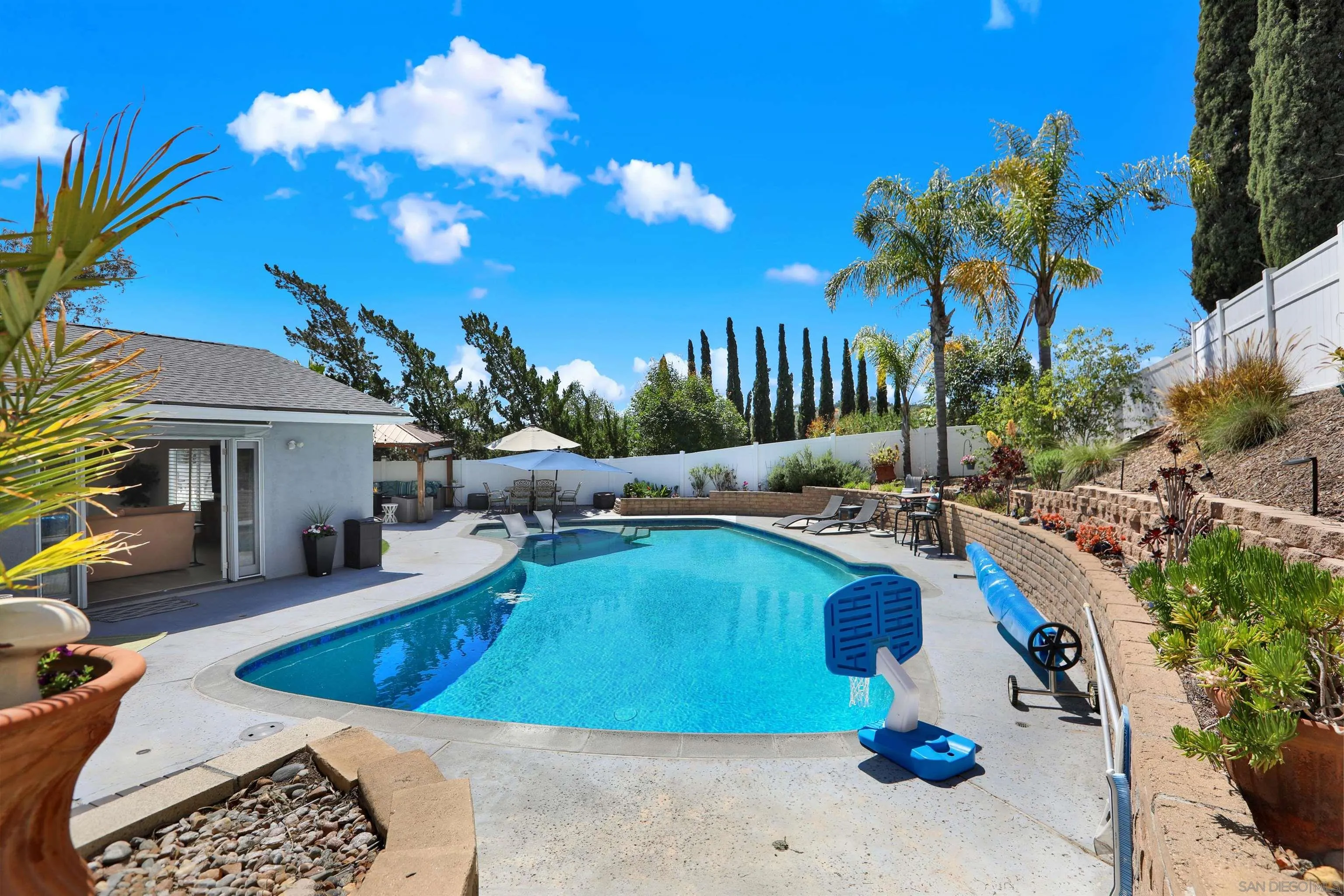 12913 Evalyn Court Poway, CA 92064 - Photo 38 of 56 a view of a swimming pool with outdoor seating