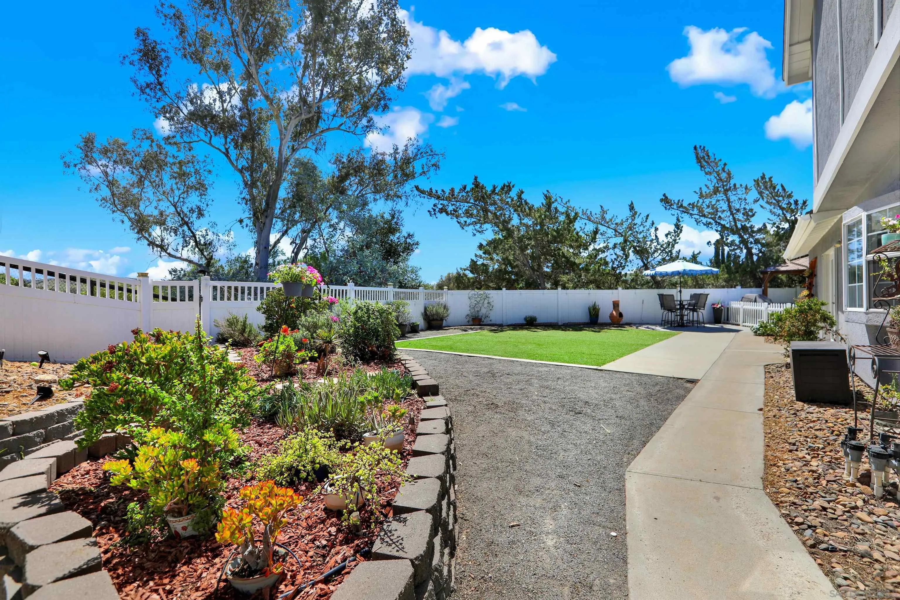 12913 Evalyn Court Poway, CA 92064 - Photo 43 of 56 a view of a garden with a fountain