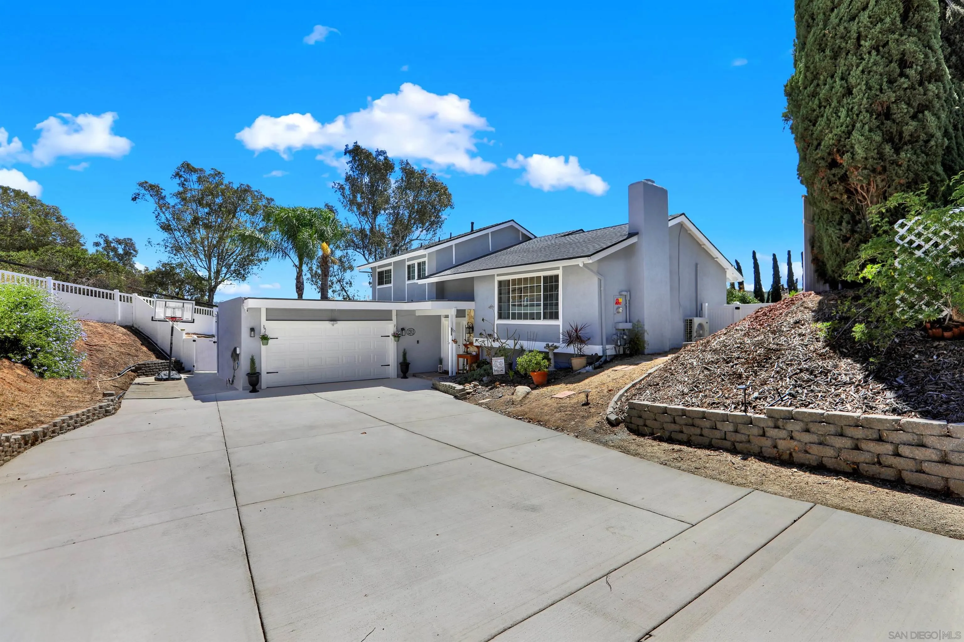 12913 Evalyn Court Poway, CA 92064 - Photo 7 of 56 a front view of a house with a yard and garage