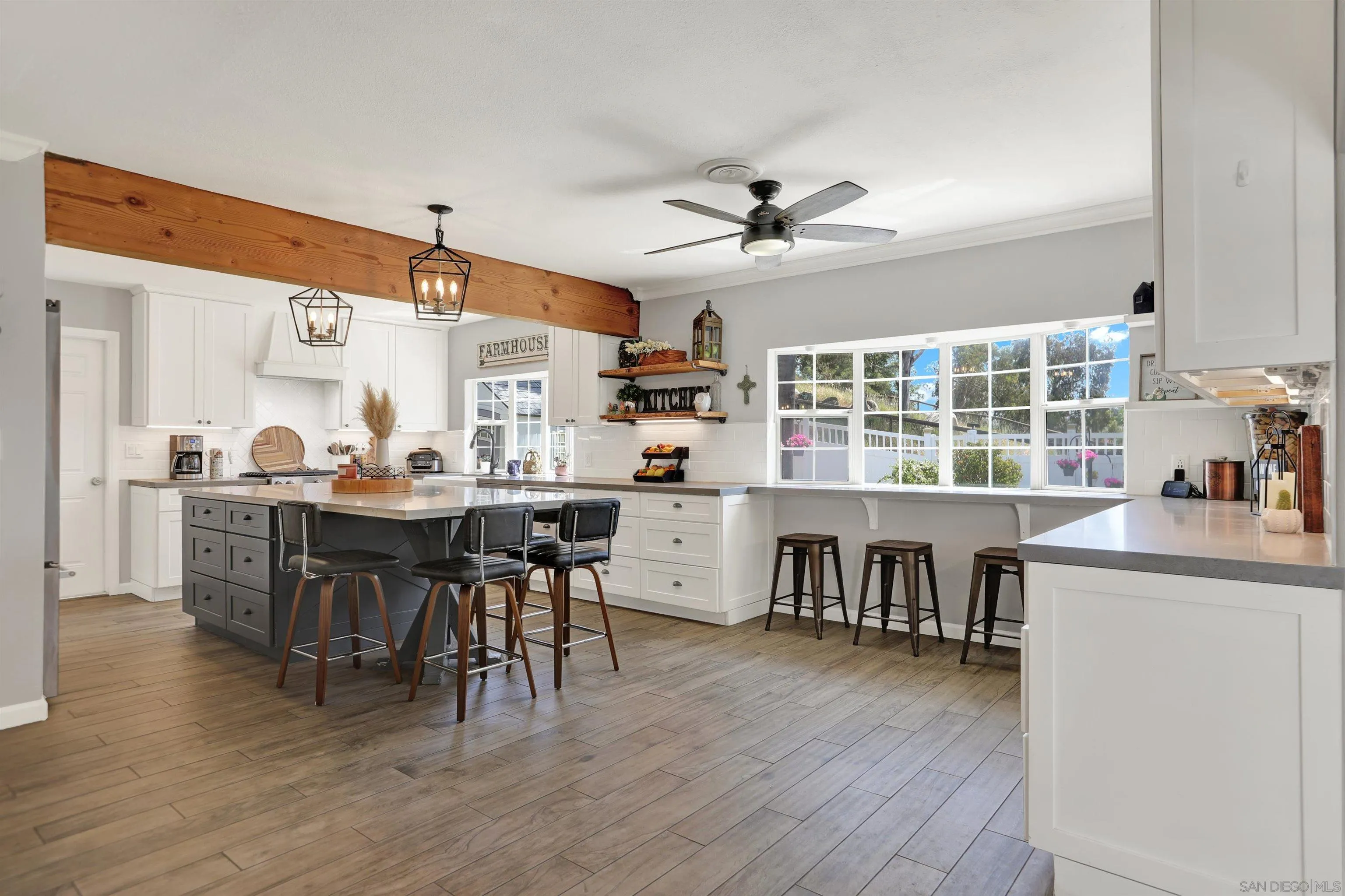 12913 Evalyn Court Poway, CA 92064 - Photo 9 of 56 a view of a dining room with furniture window and wooden floor