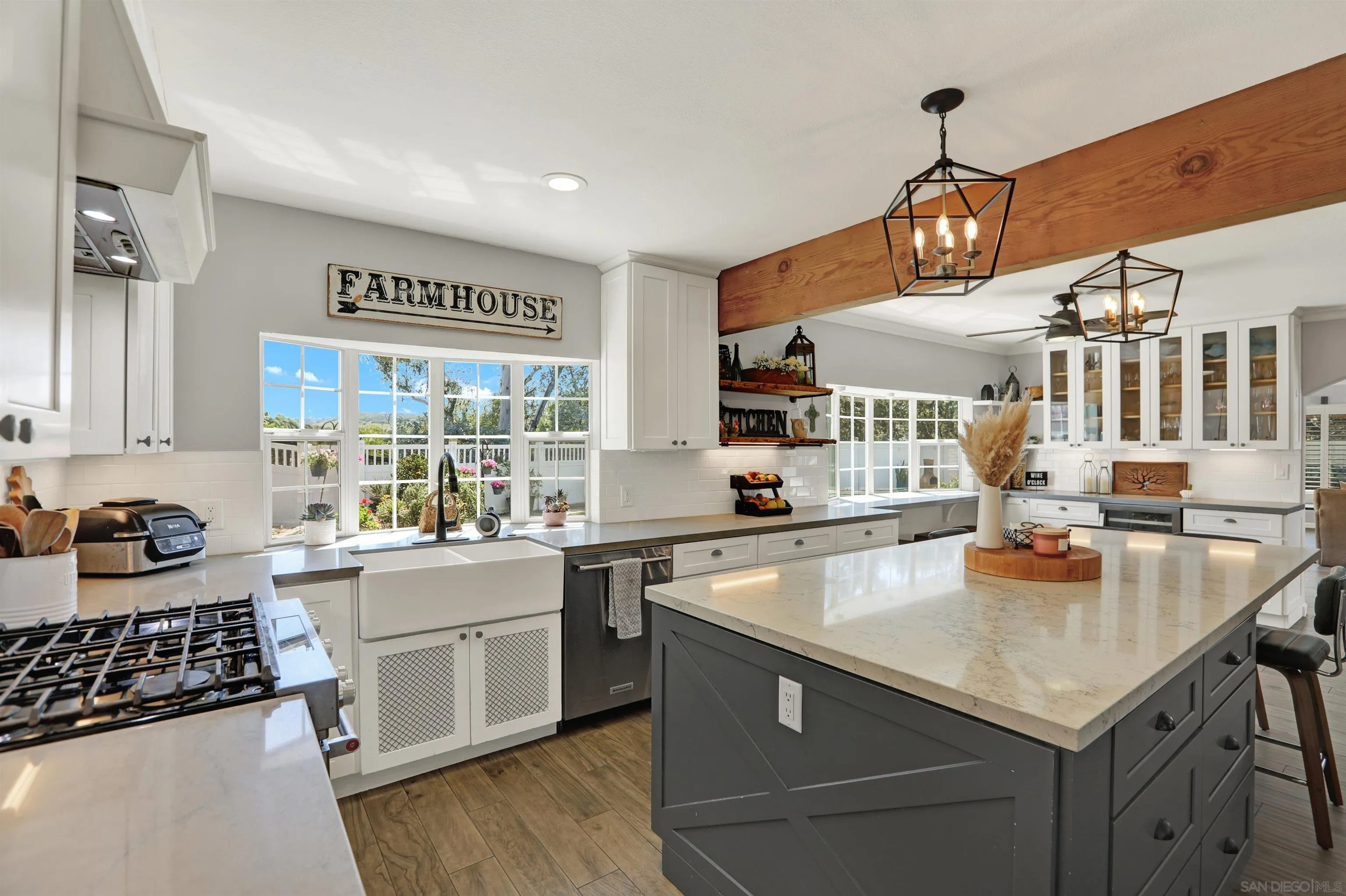 12913 Evalyn Court Poway, CA 92064 - Photo 10 of 56 a kitchen with a stove a sink and a refrigerator
