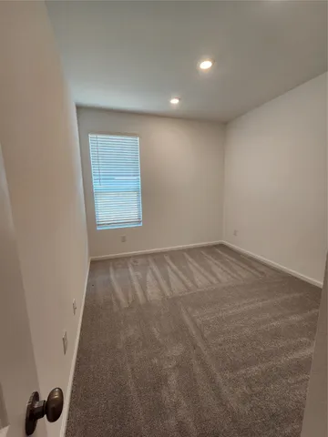 en empty room with windows