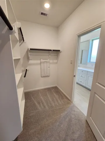 a view of an empty walk in closet