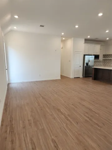 a view of kitchen with kitchen island microwave and stove