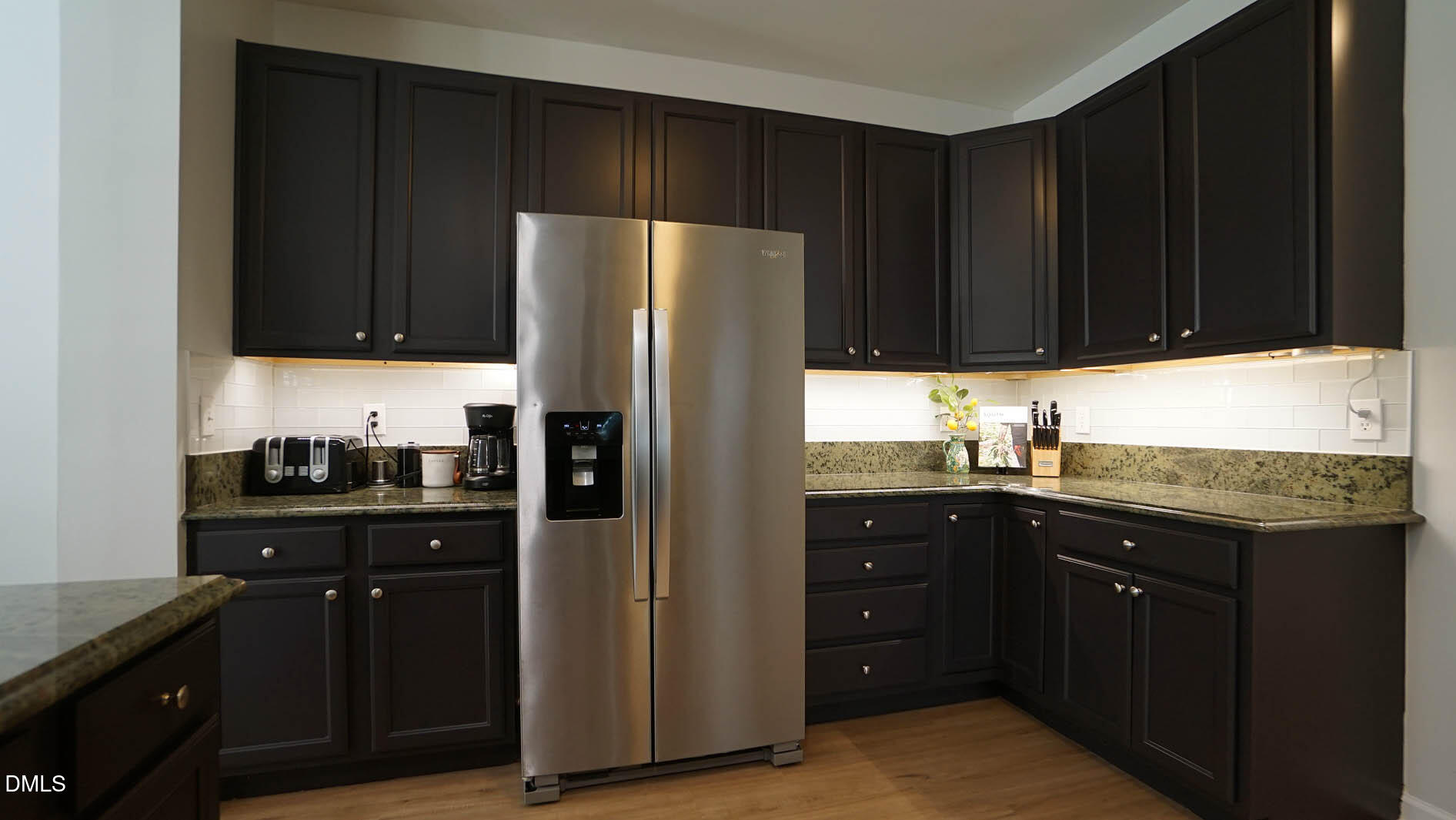 311 Inkster Cove Raleigh, NC 27603 - Photo 11 of 39 a kitchen with a sink and a refrigerator