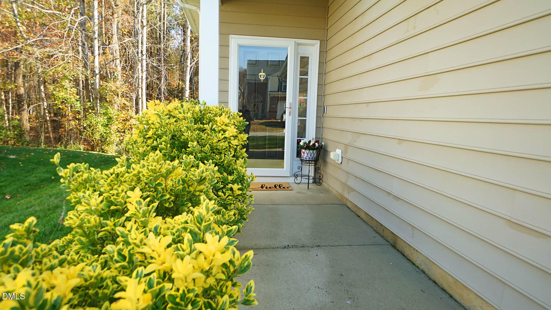 311 Inkster Cove Raleigh, NC 27603 - Photo 3 of 39 a yellow house with a outdoor space