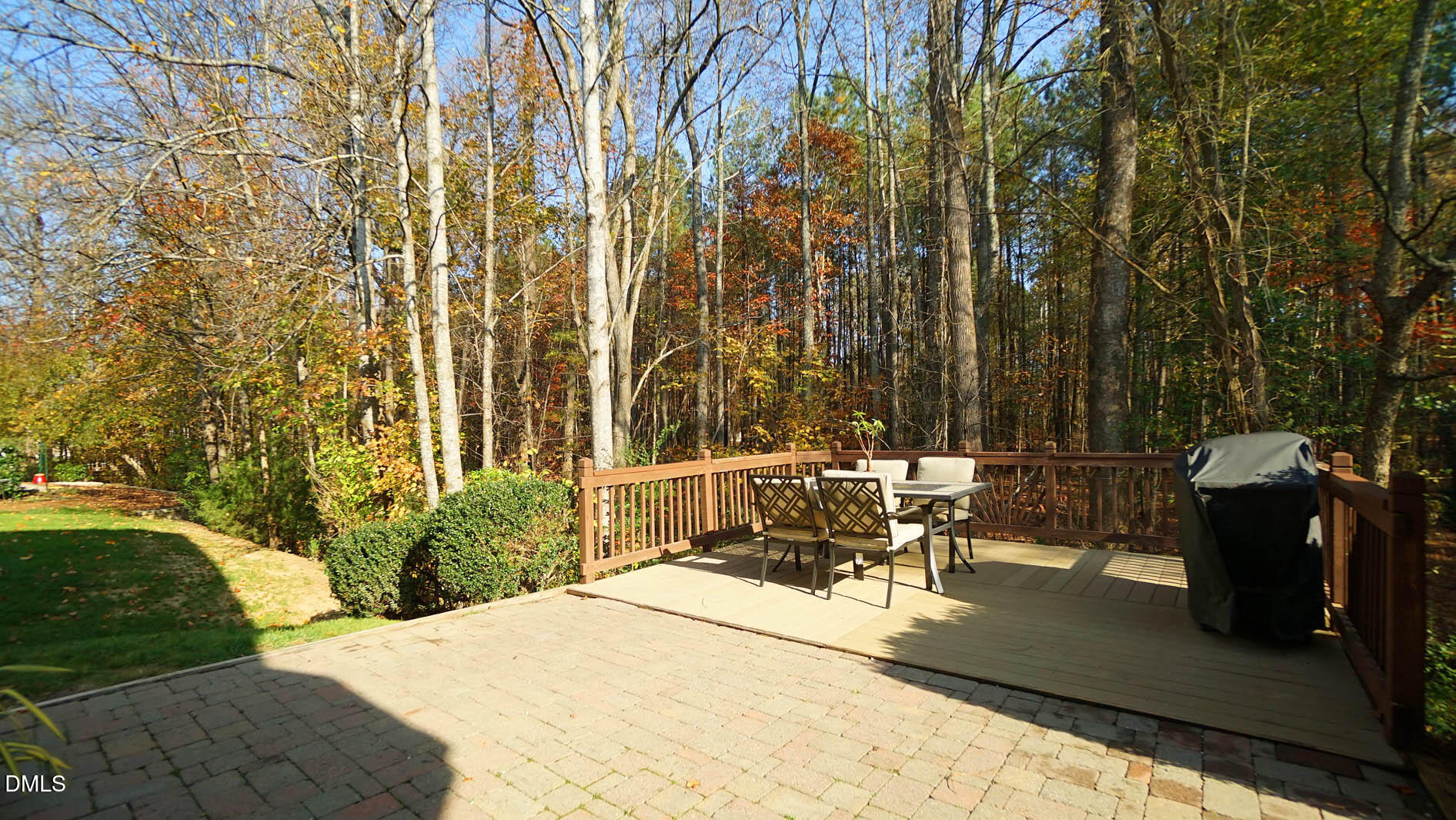 311 Inkster Cove Raleigh, NC 27603 - Photo 31 of 39 a view of a patio with table and chairs with wooden fence and plants