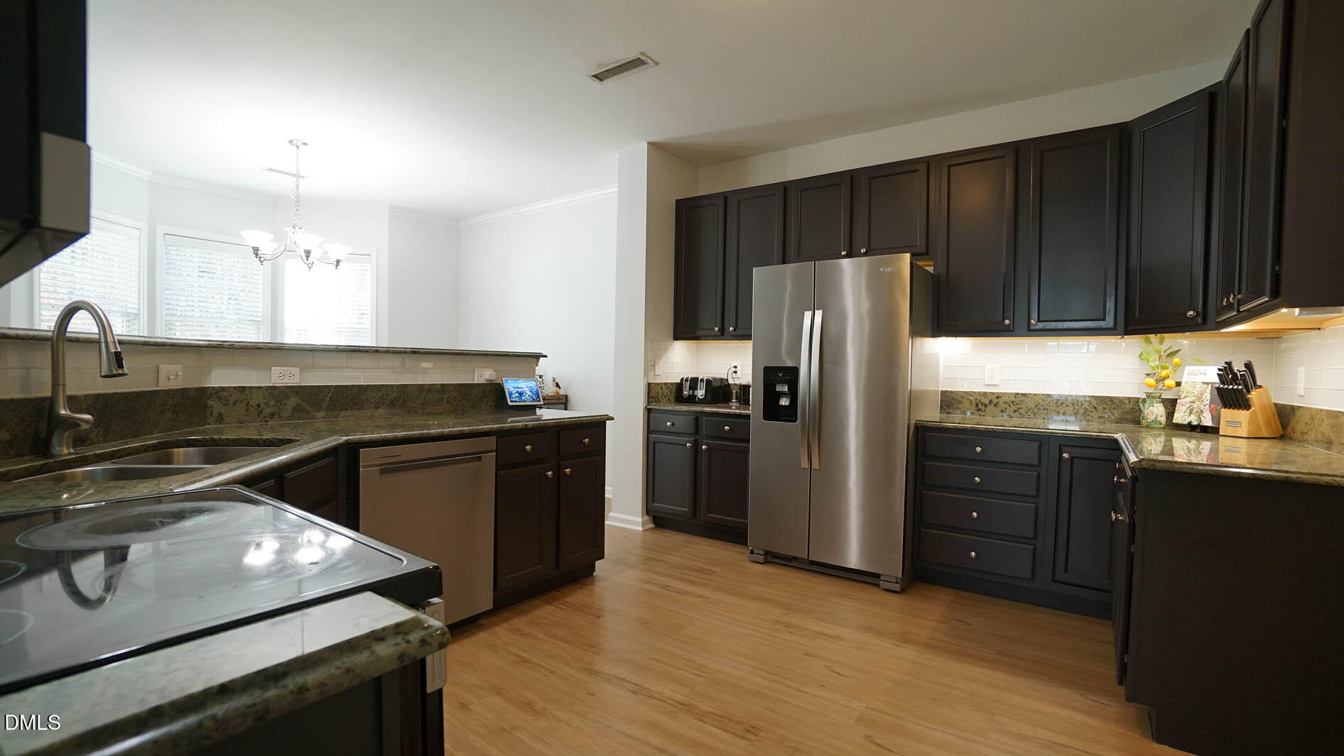 311 Inkster Cove Raleigh, NC 27603 - Photo 9 of 39 a kitchen with a refrigerator stove and sink